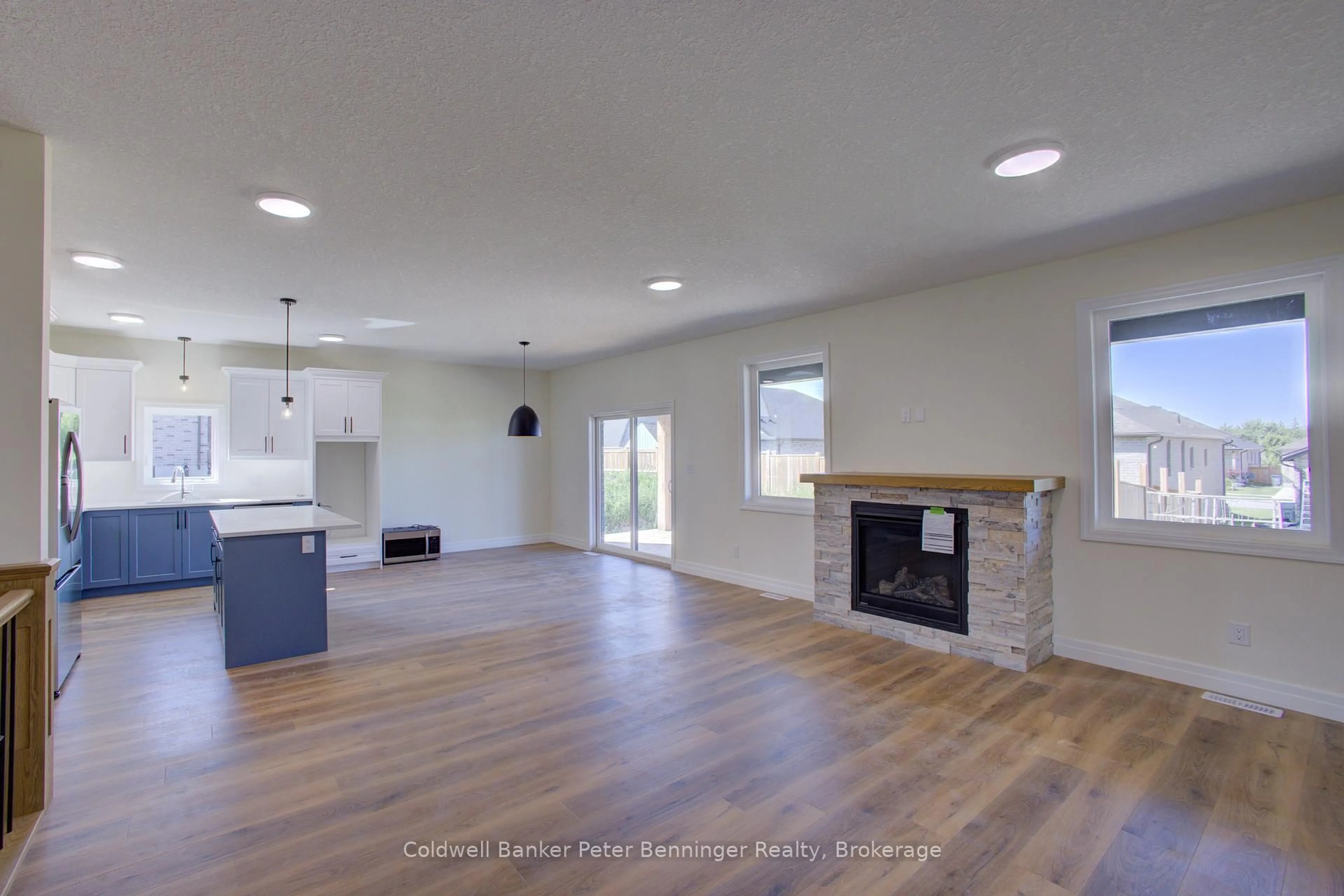 Open concept kitchen, wood/laminate floor for 128 Pugh St, Perth East Ontario N0K 1M0
