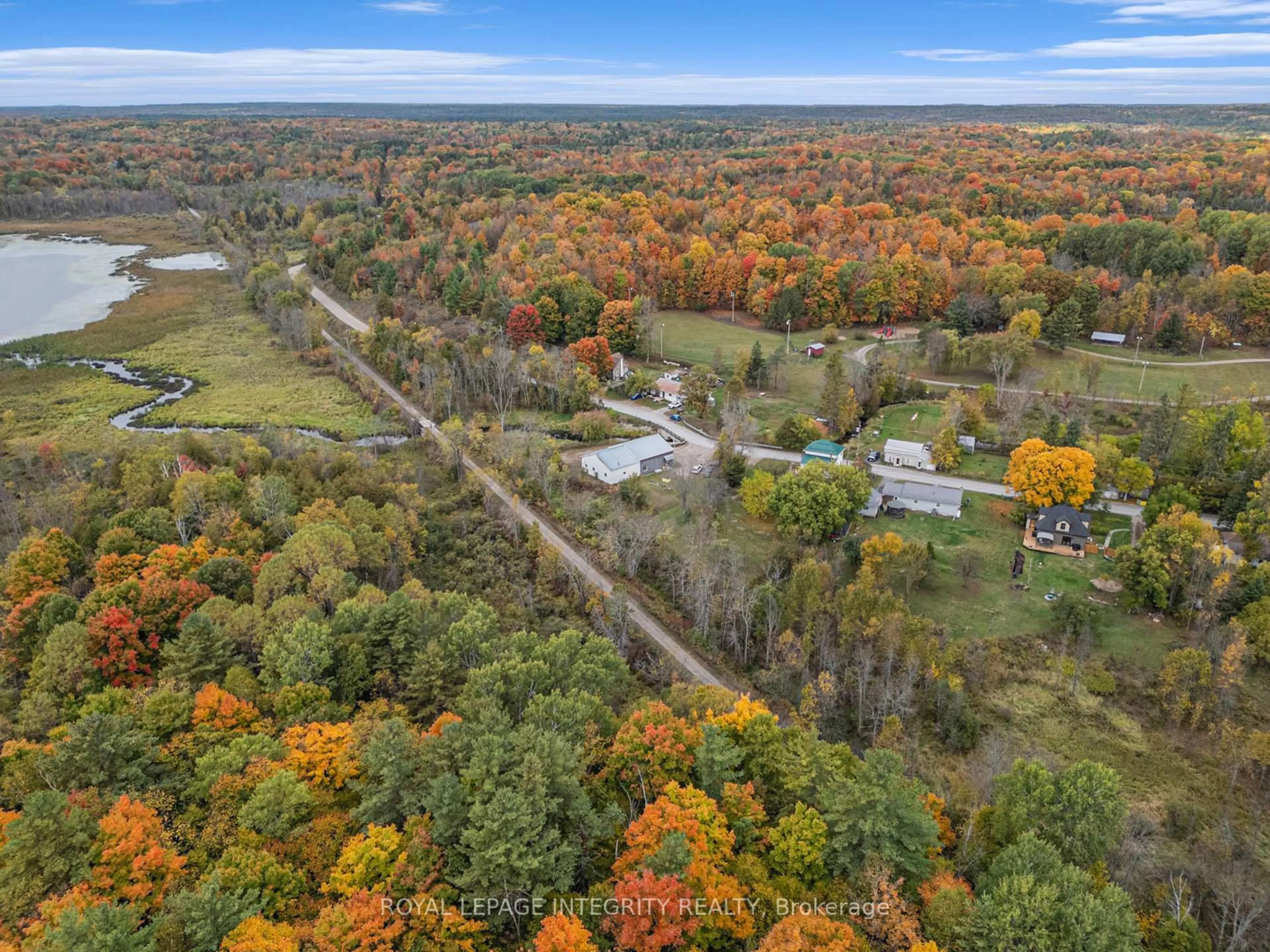 A pic from outside/outdoor area/front of a property/back of a property/a pic from drone, forest/trees view for 1081 Elm Tree Rd, Arden Ontario K0H 1B0