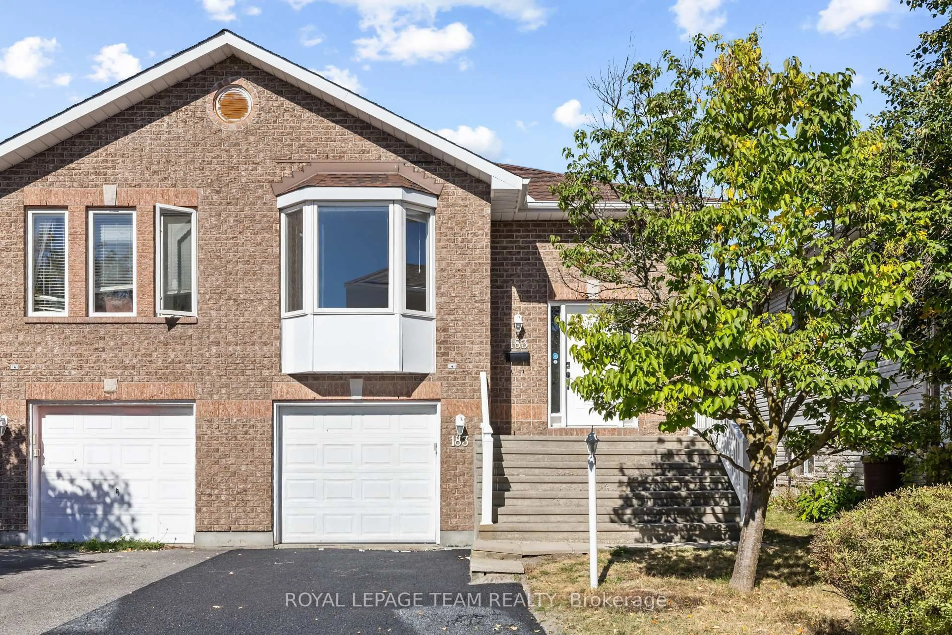 Home with brick exterior material, street for 183 Mountshannon Dr, Ottawa Ontario K2J 4R9