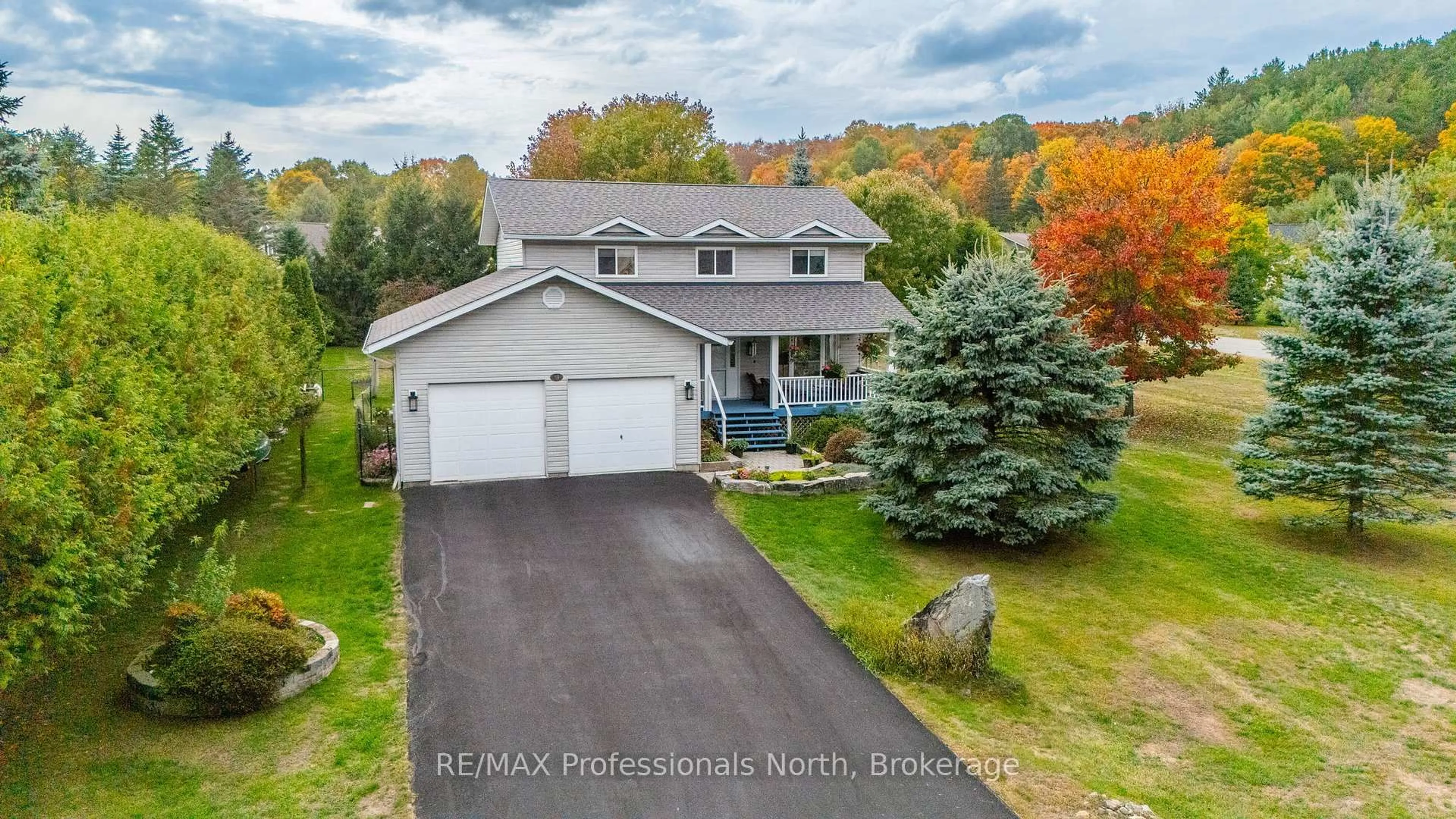 A pic from outside/outdoor area/front of a property/back of a property/a pic from drone, street for 13 Glebe Rd, Dysart et al Ontario K0M 1S0
