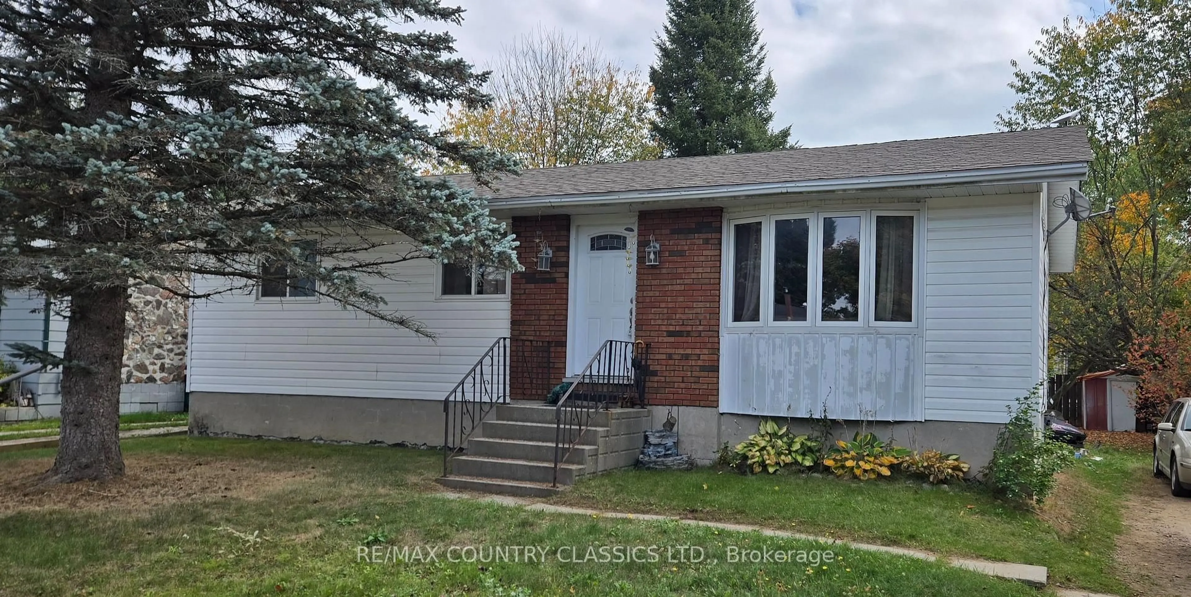 Home with vinyl exterior material, street for 7 Hemlock St, Highlands East Ontario K0L 1M0