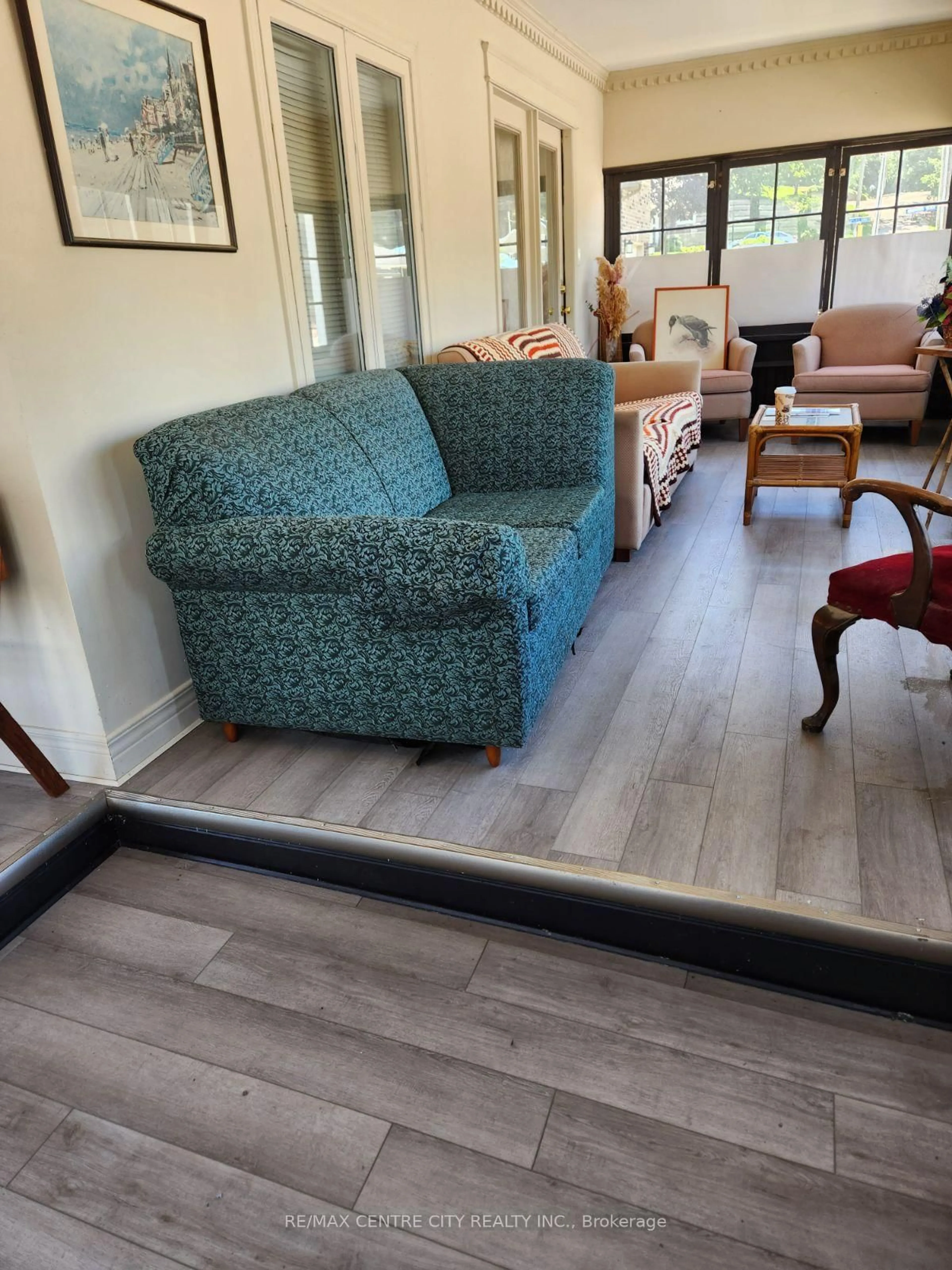 Living room with furniture, wood/laminate floor for 328 Erie St, Central Elgin Ontario N5L 1E3