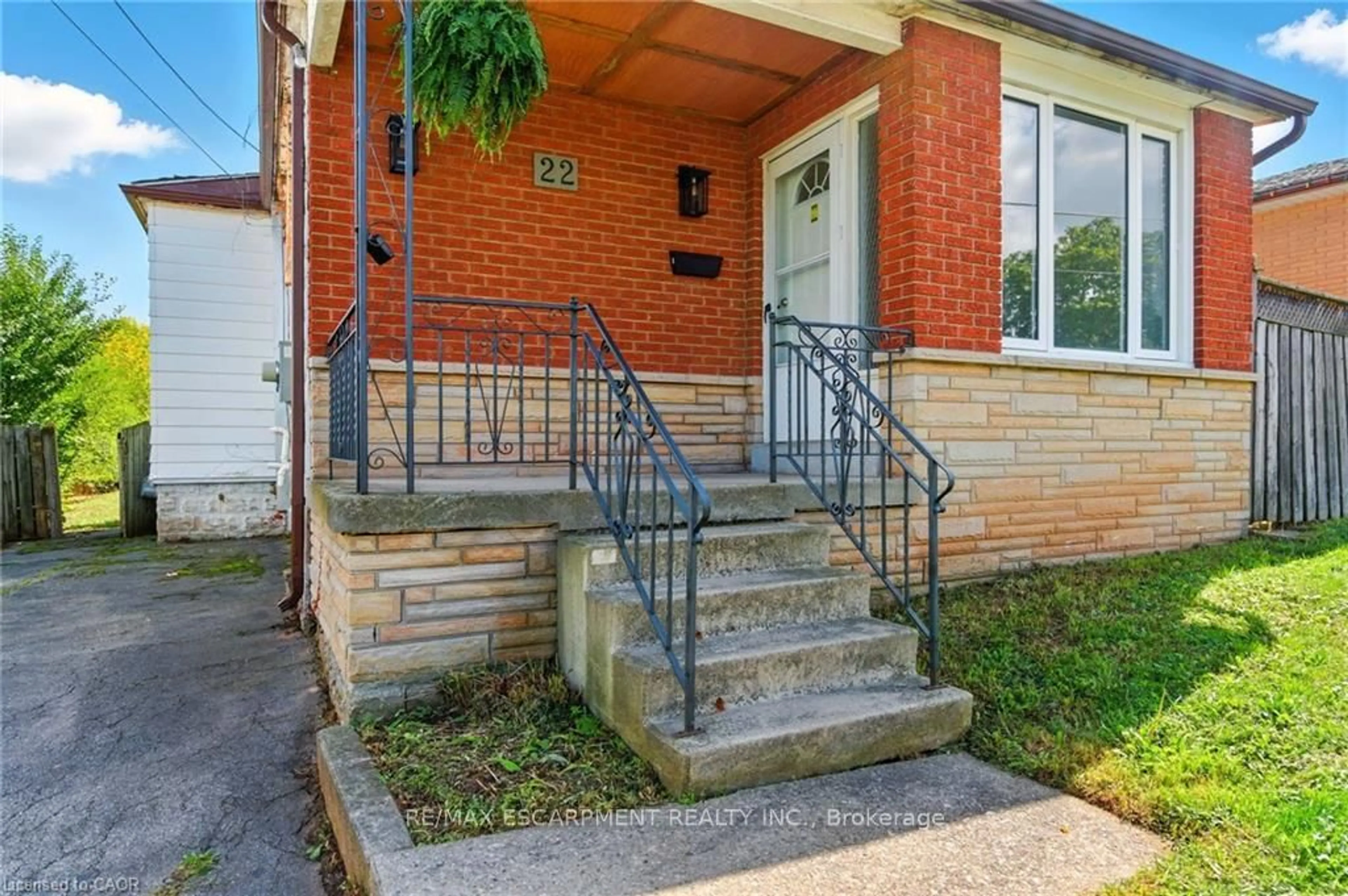 Home with brick exterior material, street for 22 Worsley Rd, Hamilton Ontario L8E 2E7