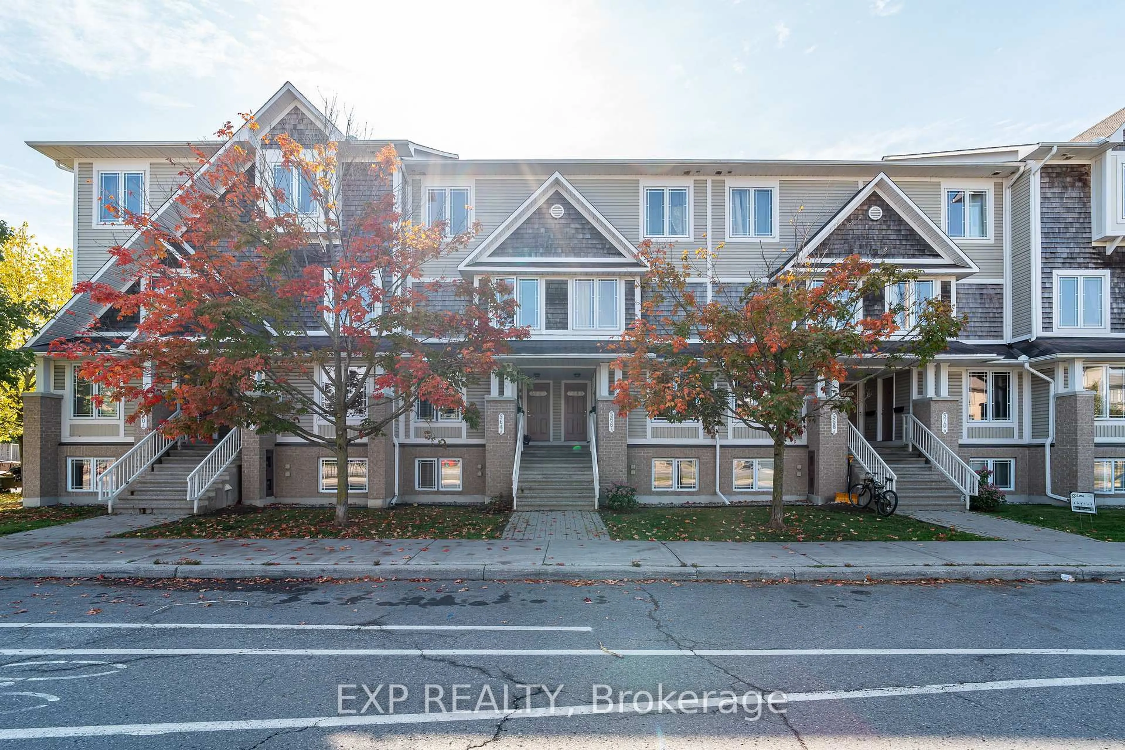 A pic from outside/outdoor area/front of a property/back of a property/a pic from drone, street for 566 Chapman Mills Dr #A, Ottawa Ontario K2J 3V2
