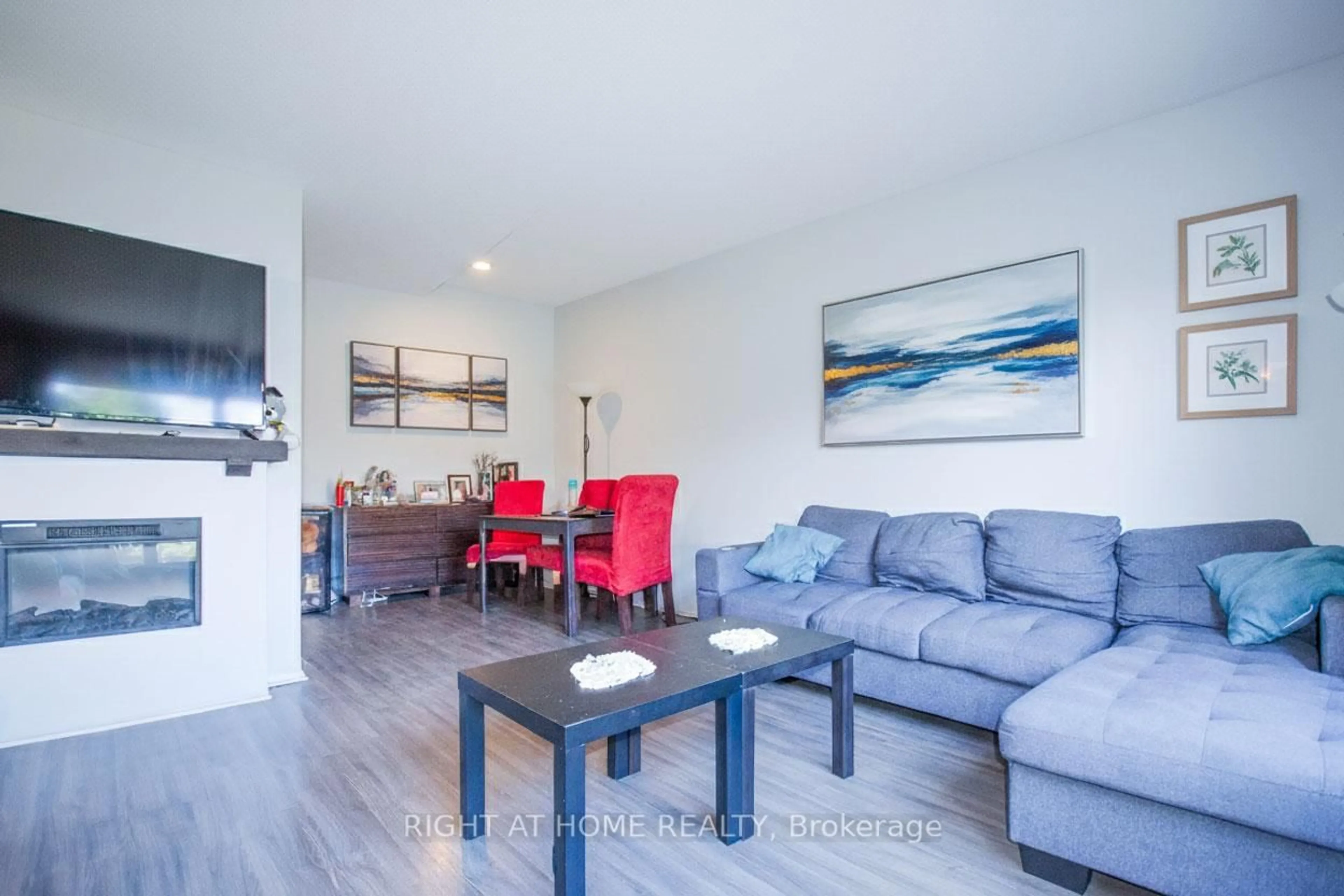 Living room with furniture, wood/laminate floor for 2640 Draper Ave #53, Ottawa Ontario K2H 8V3