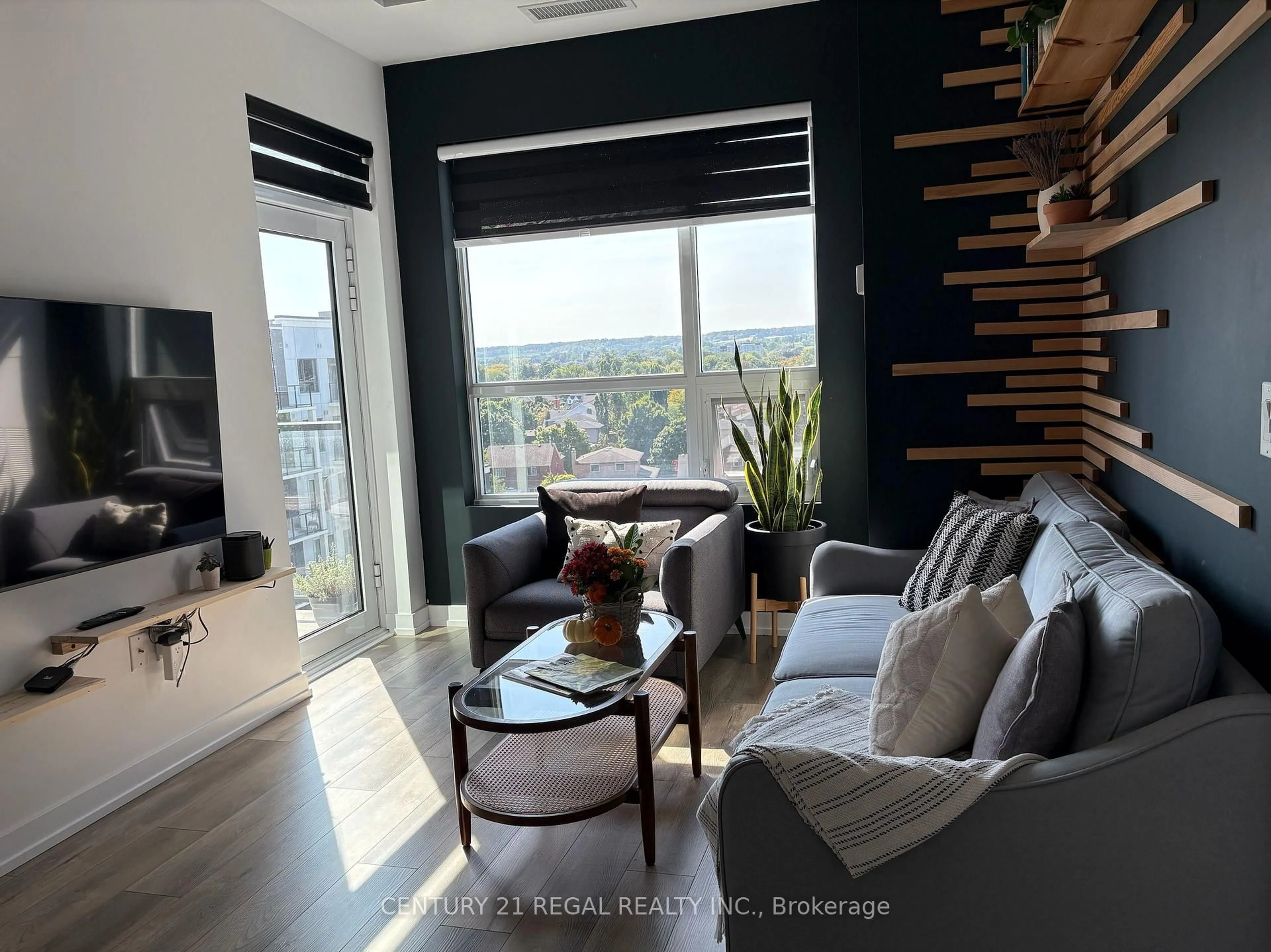 Living room with furniture, wood/laminate floor for 5055 Greenlane Rd #633, Lincoln Ontario L0R 1B3