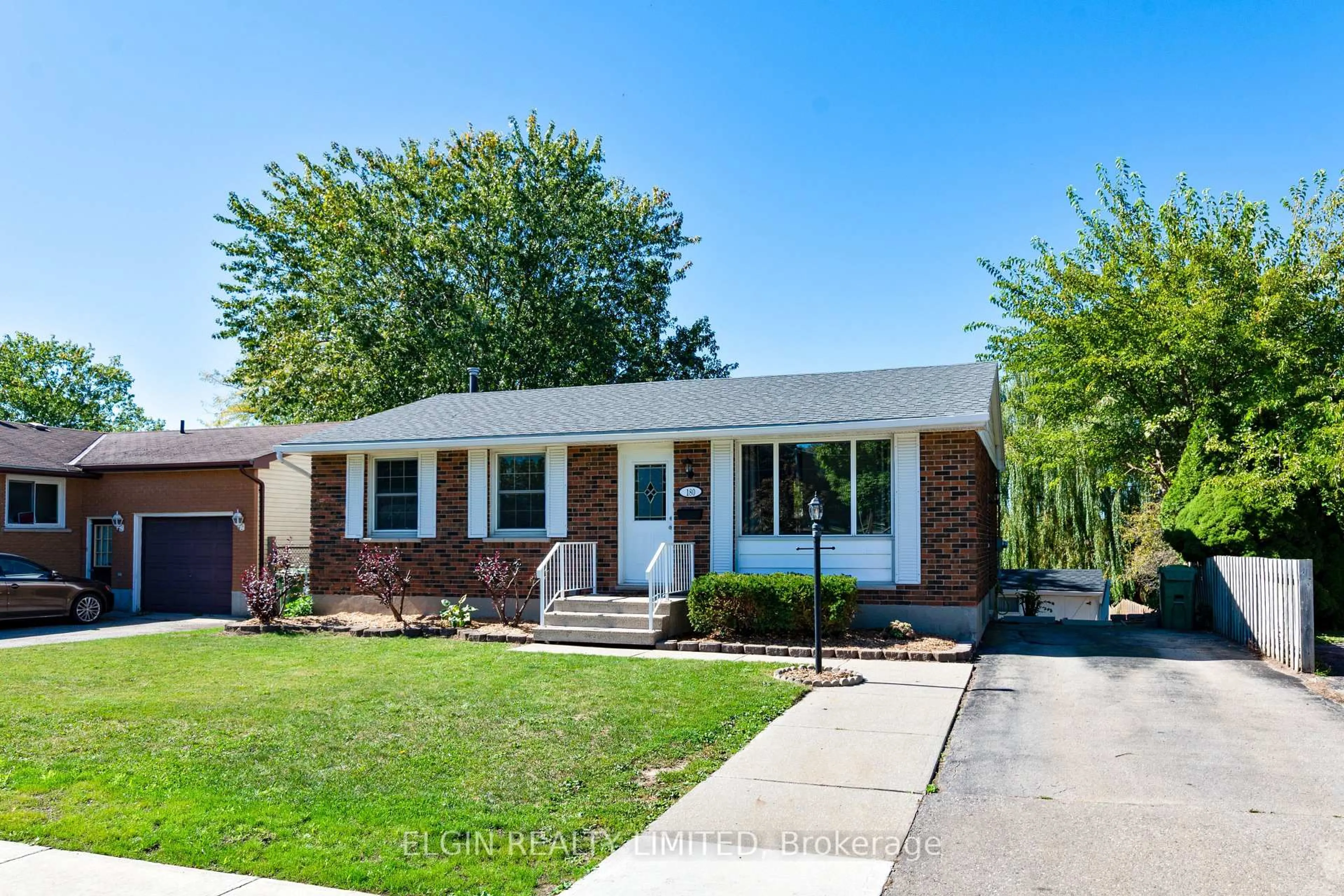 Home with brick exterior material, street for 180 Fairview Ave, St. Thomas Ontario N5R 4Y1