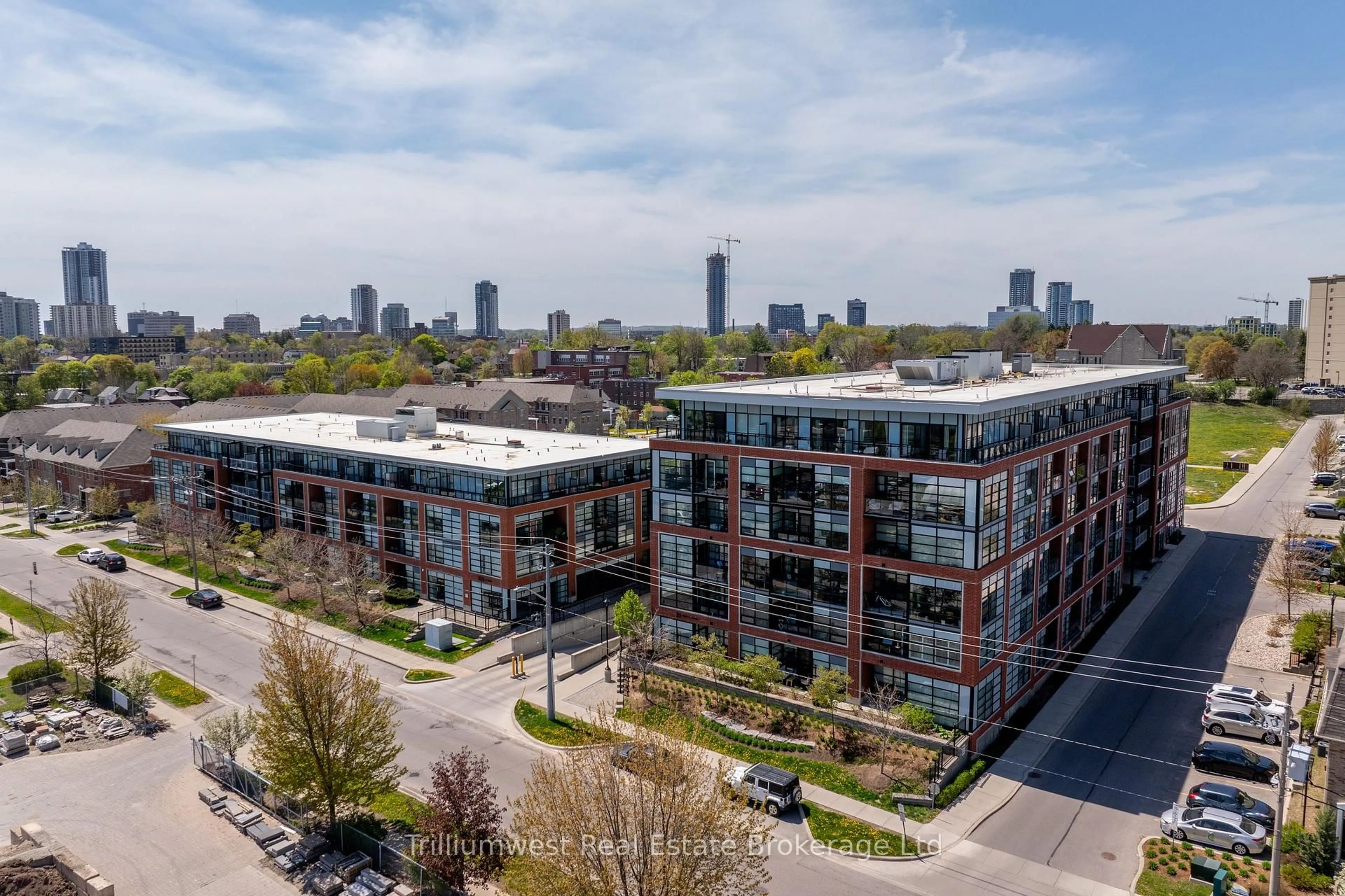 A pic from outside/outdoor area/front of a property/back of a property/a pic from drone, city buildings view from balcony for 155 St Leger St #412, Kitchener Ontario N2H 0B9