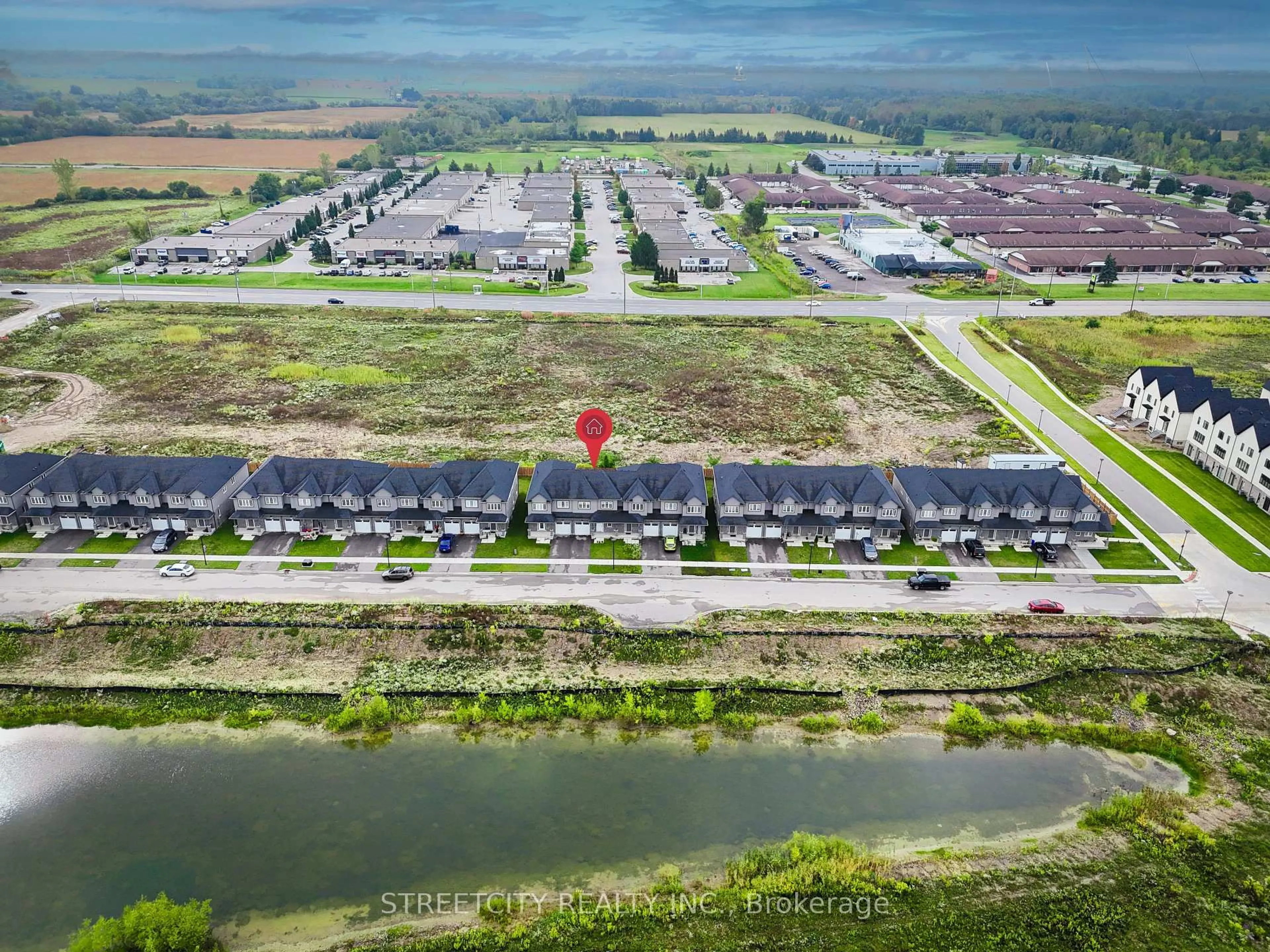 A pic from outside/outdoor area/front of a property/back of a property/a pic from drone, water/lake/river/ocean view for 307 Kennington Way, London South Ontario N6L 0H4