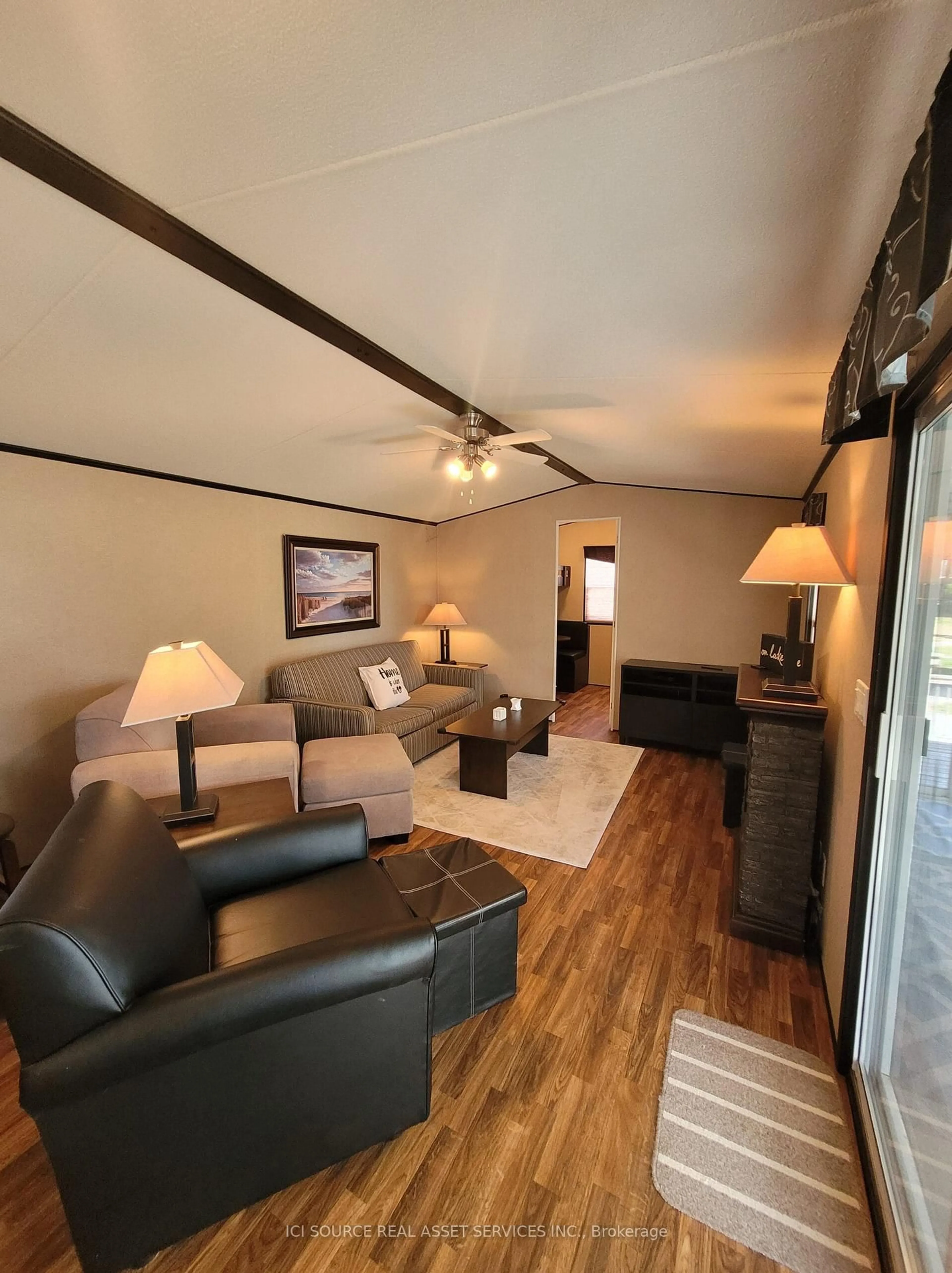 Living room with furniture, wood/laminate floor for 171 Woodland Estates Rd #LVD04, Trent Hills Ontario K0L 1L0