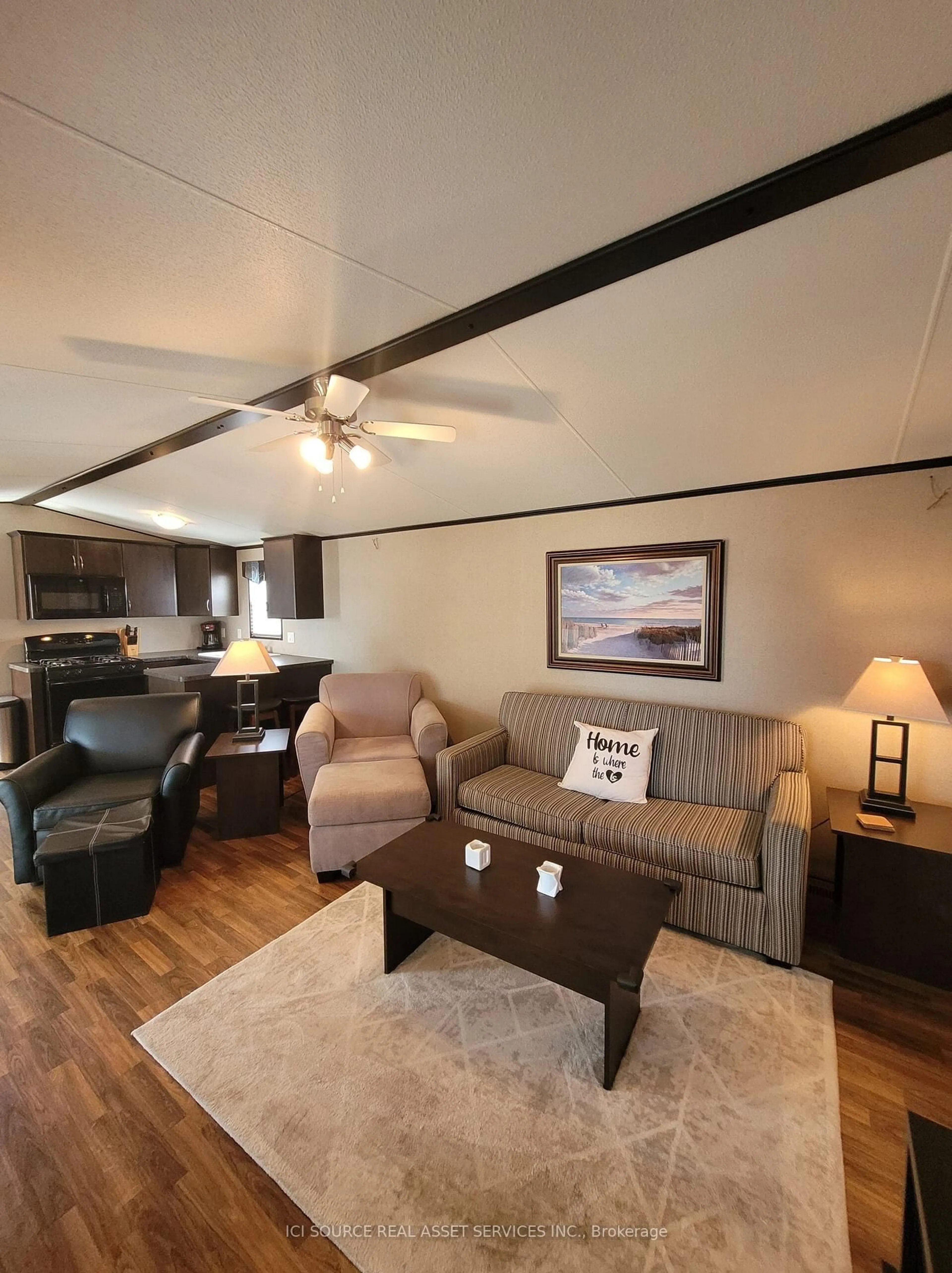 Living room with furniture, wood/laminate floor for 171 Woodland Estates Rd #LVD04, Trent Hills Ontario K0L 1L0