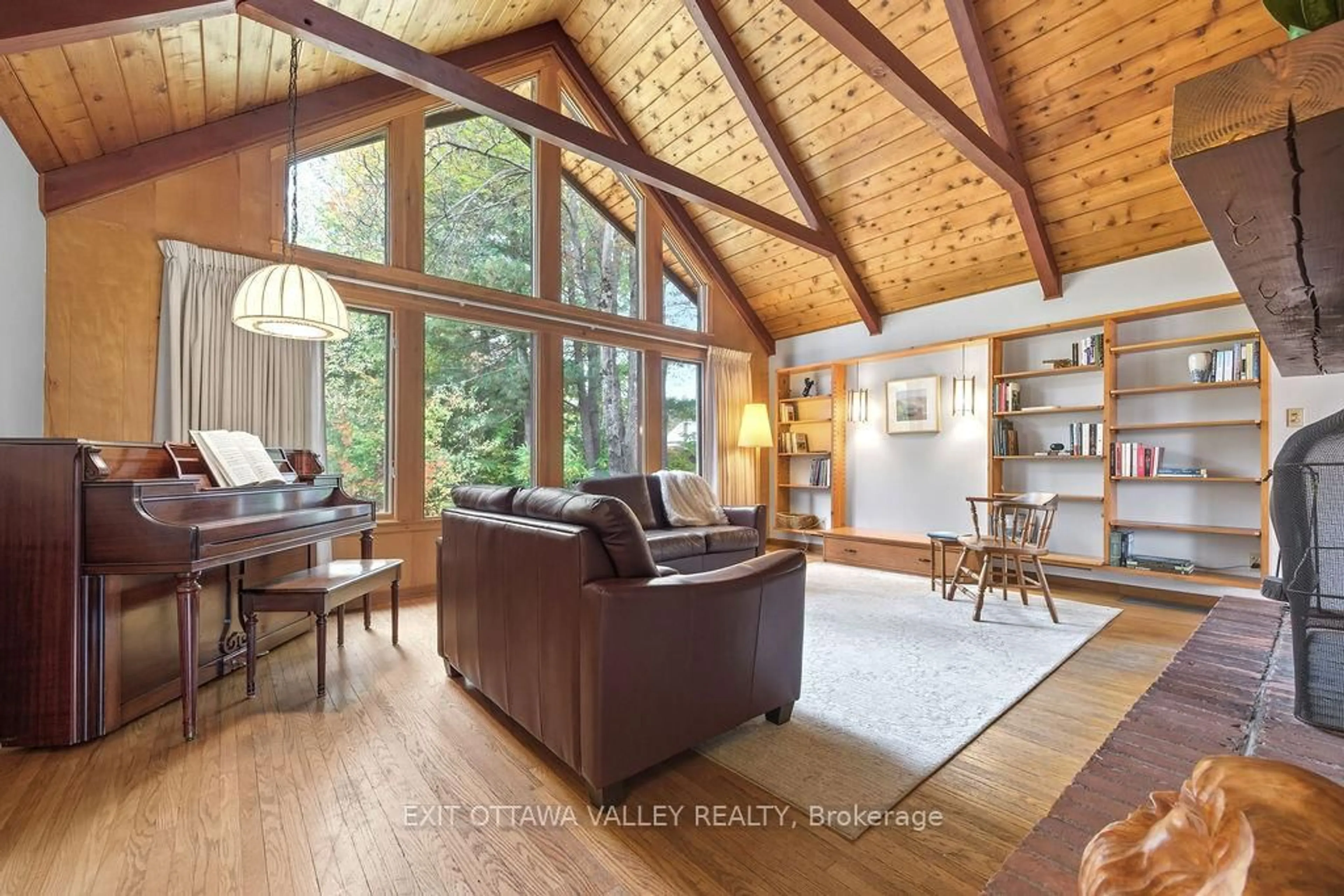 Living room with furniture, wood/laminate floor for 53 James St, Deep River Ontario K0J 1P0