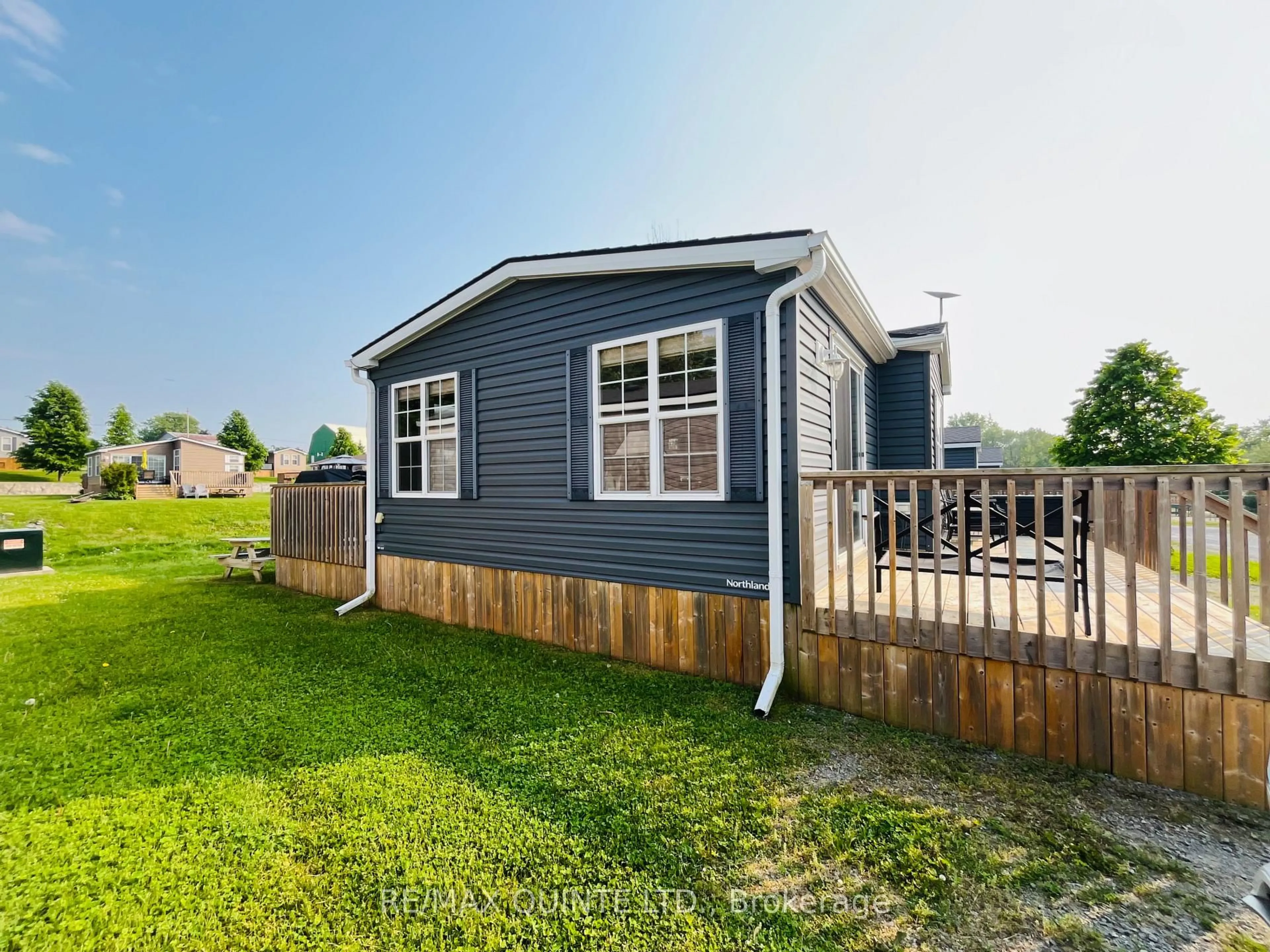 Home with vinyl exterior material, street for 486 County Road 18 #8 Cricket Ln, Prince Edward County Ontario K0K 1P0