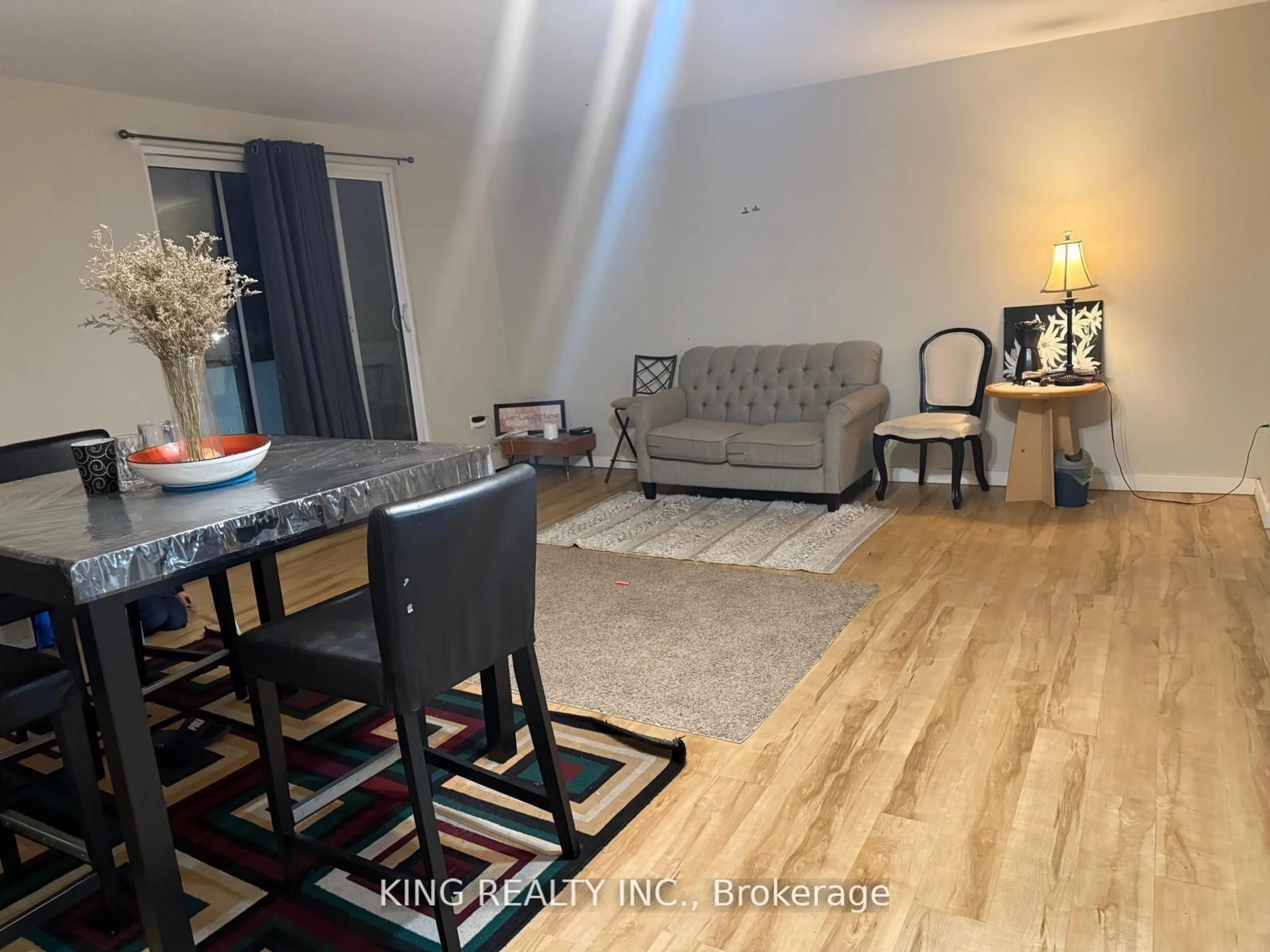 Living room with furniture, wood/laminate floor for 563 MORNINGTON Ave #302, London East Ontario N5Y 4T8