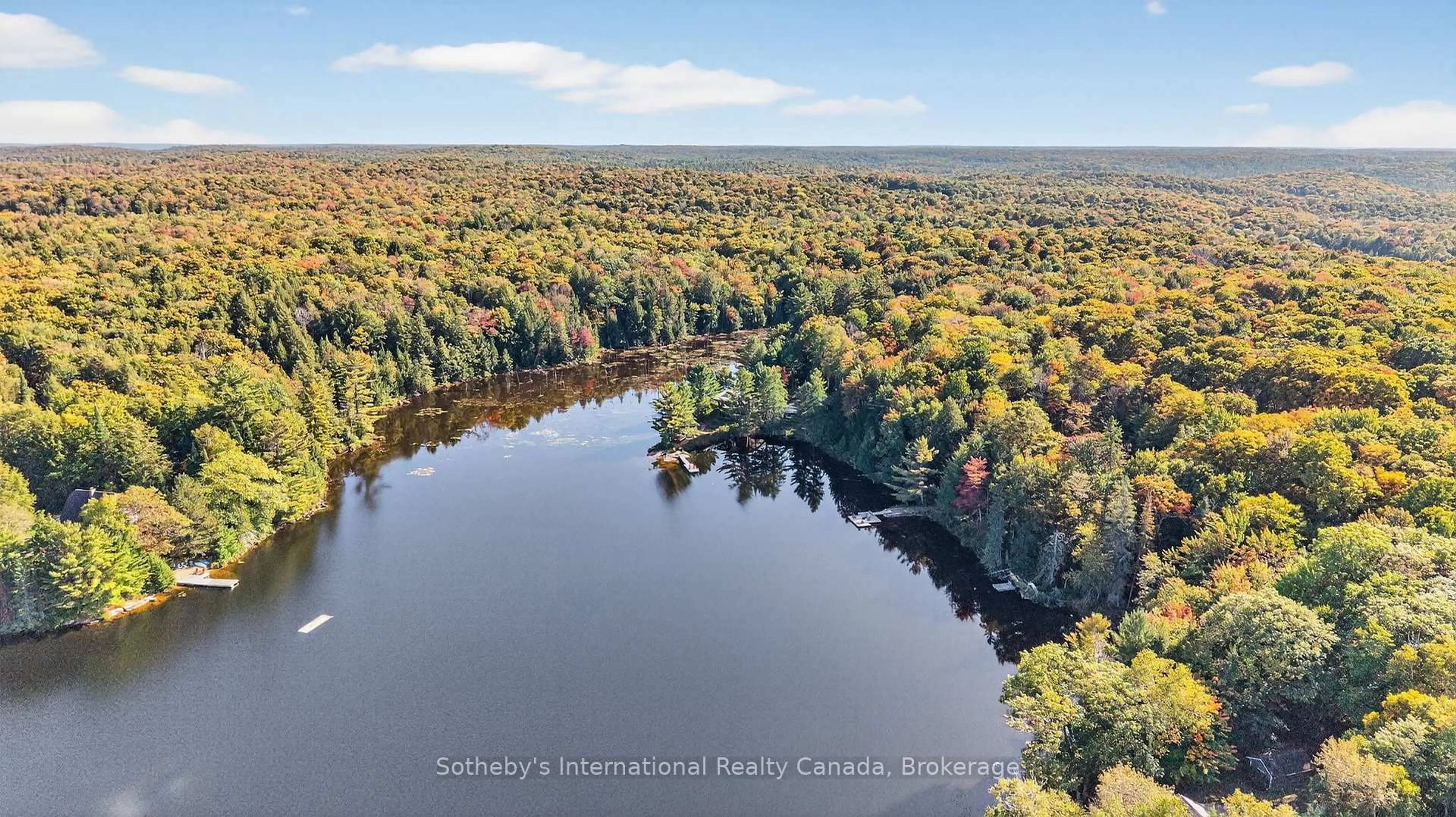 A pic from outside/outdoor area/front of a property/back of a property/a pic from drone, water/lake/river/ocean view for 463 Otter Lake Rd, Huntsville Ontario P1H 2J3