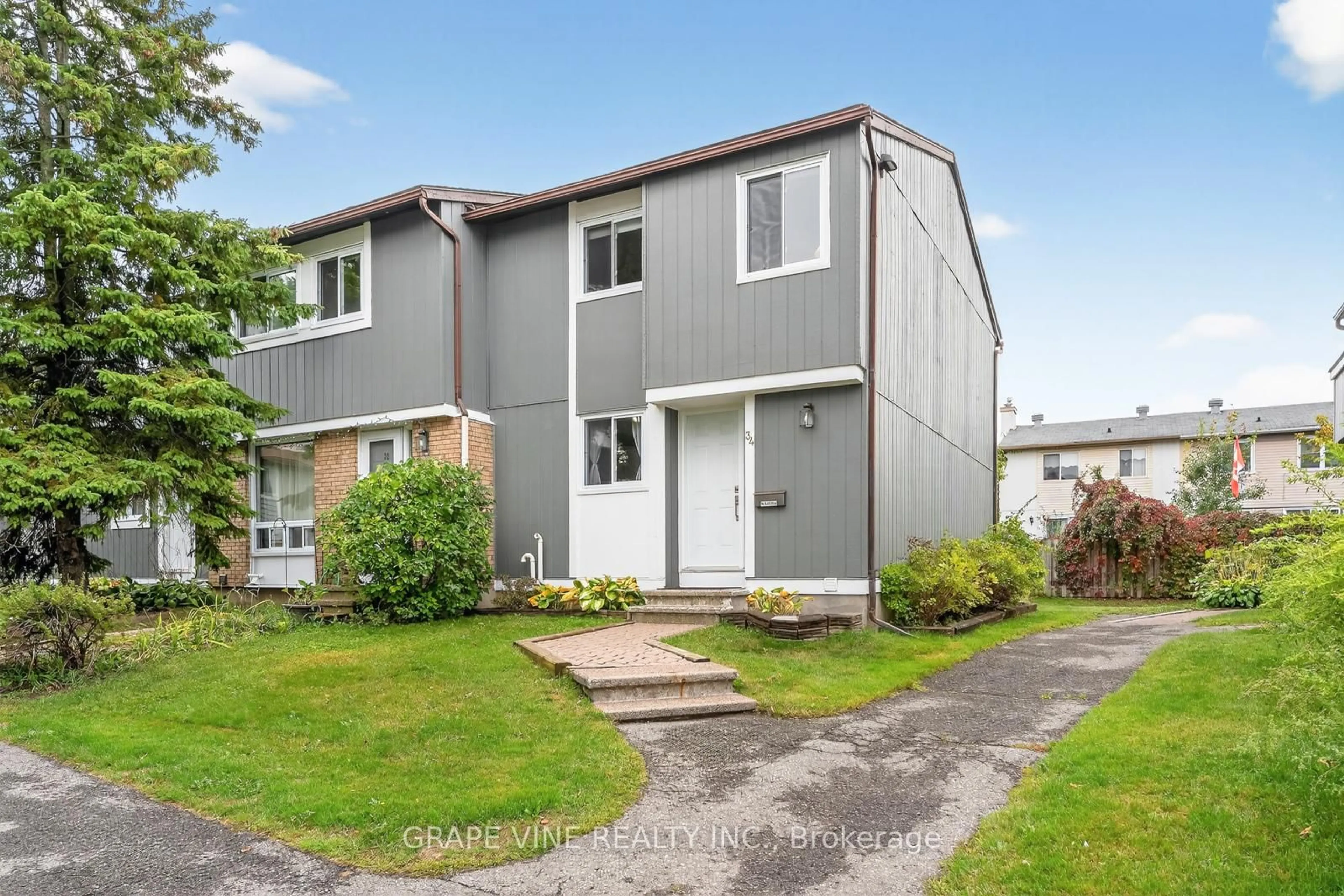 Home with vinyl exterior material, street for 34 Sherway Dr #61, Ottawa Ontario K2J 1N3