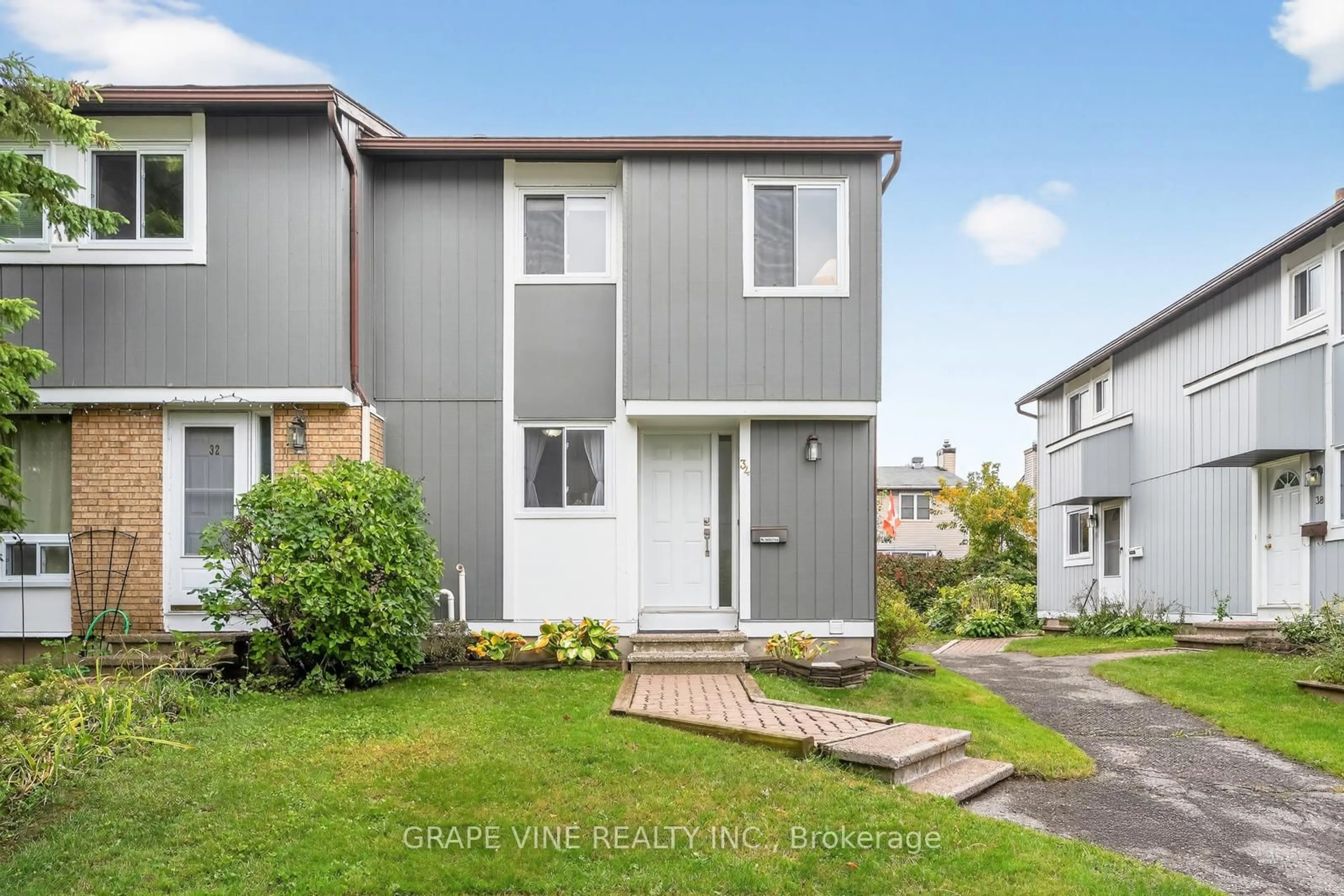 Home with vinyl exterior material, street for 34 Sherway Dr #61, Ottawa Ontario K2J 1N3