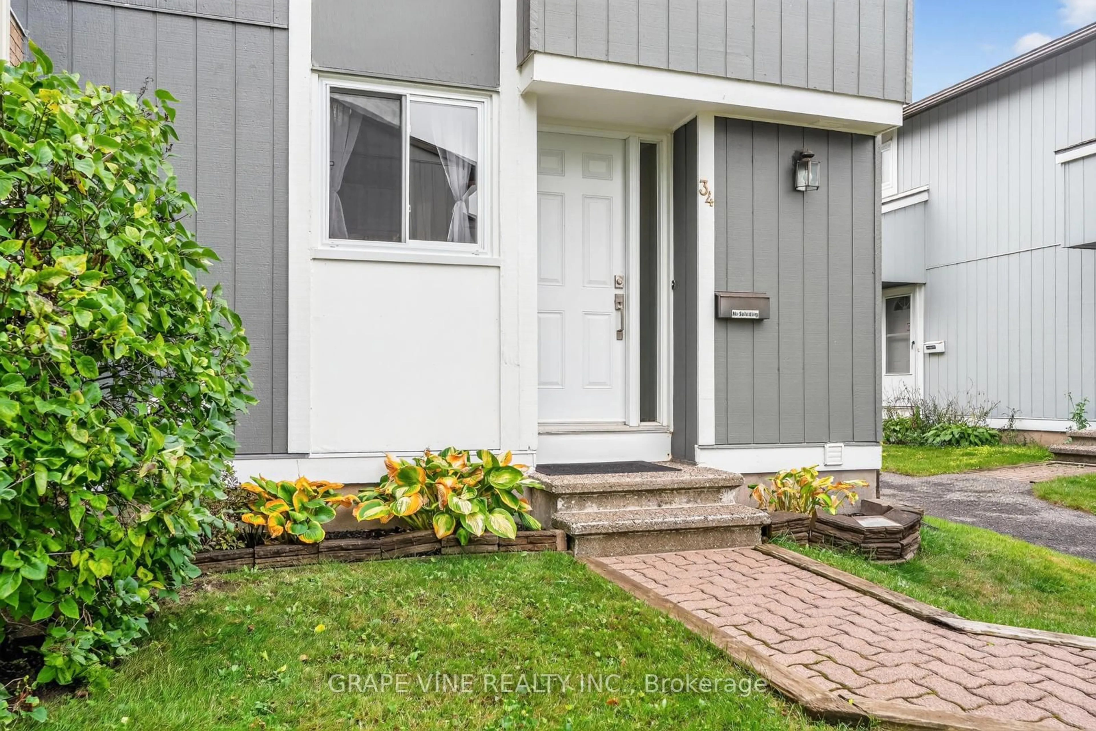 Home with vinyl exterior material, street for 34 Sherway Dr #61, Ottawa Ontario K2J 1N3