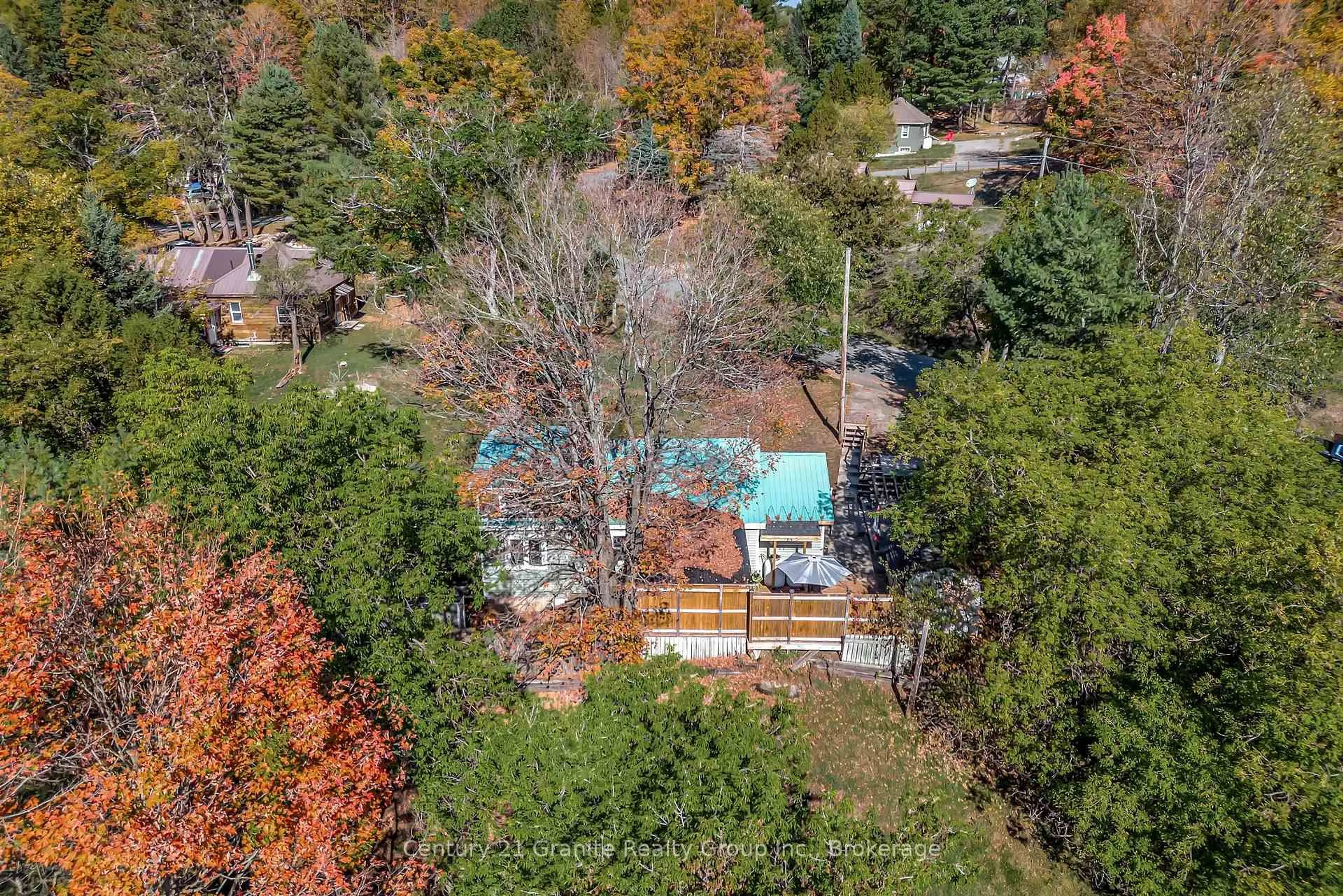A pic from outside/outdoor area/front of a property/back of a property/a pic from drone, forest/trees view for 91 Pine Ave, Dysart et al Ontario K0M 1S0