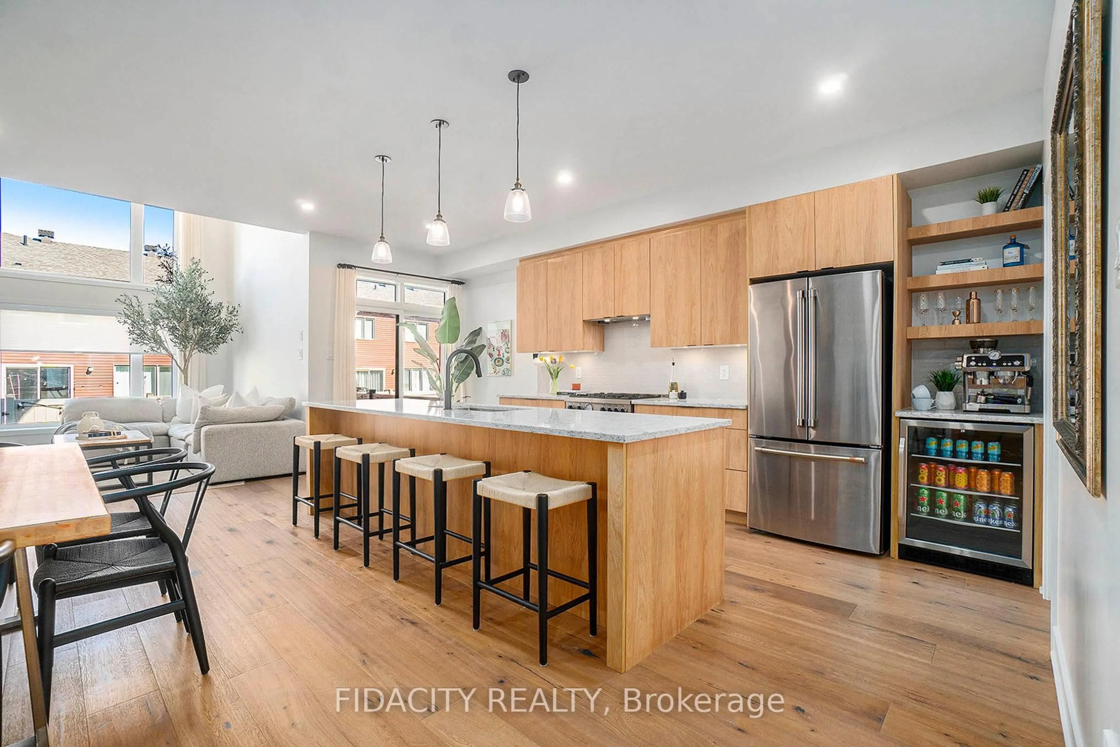 Open concept kitchen, wood/laminate floor for 712 Twist Way, Ottawa Ontario K2V 0M8
