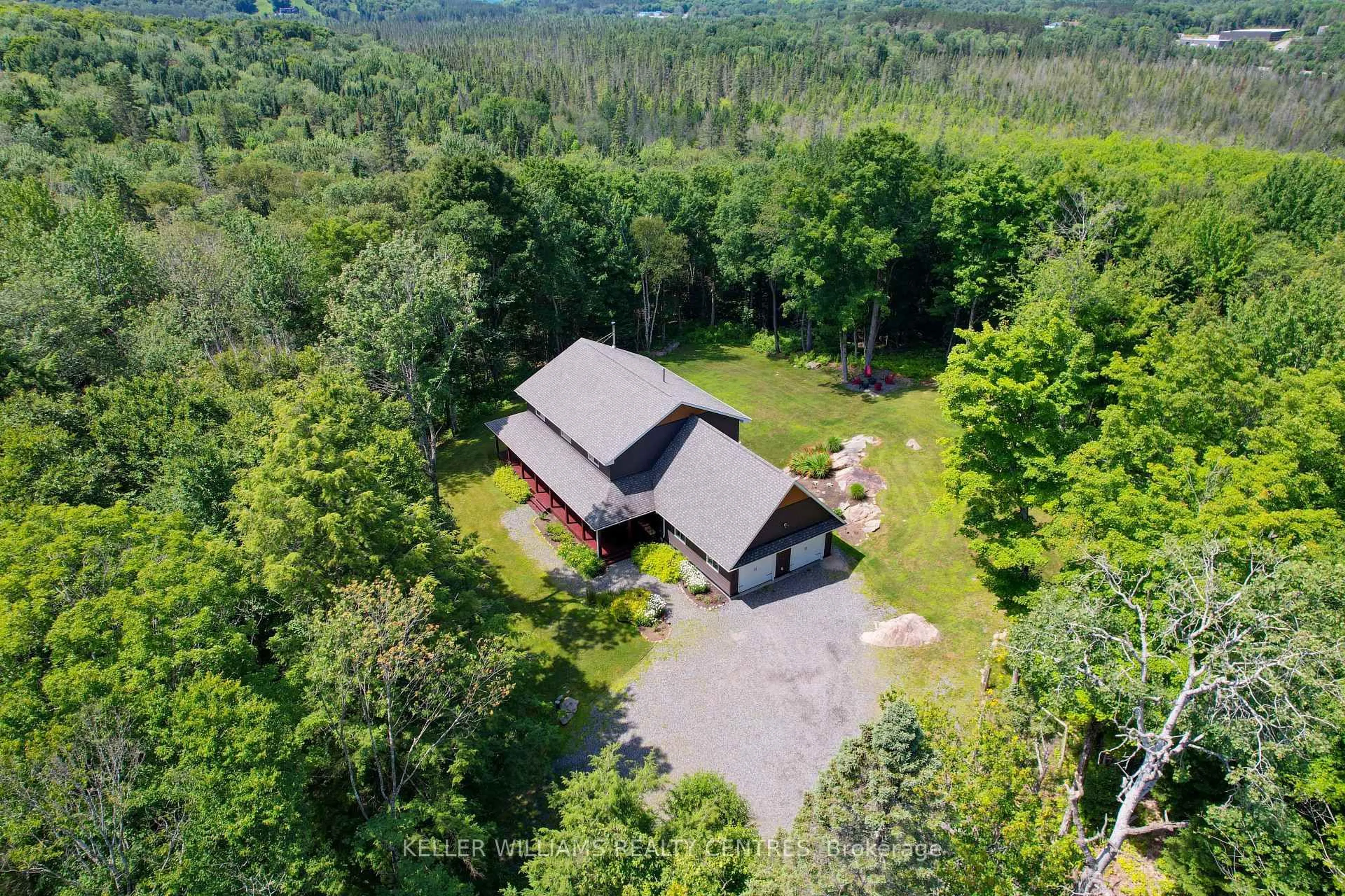 A pic from outside/outdoor area/front of a property/back of a property/a pic from drone, mountain view for 96 Lindgren Rd, Huntsville Ontario P1H 1Y6