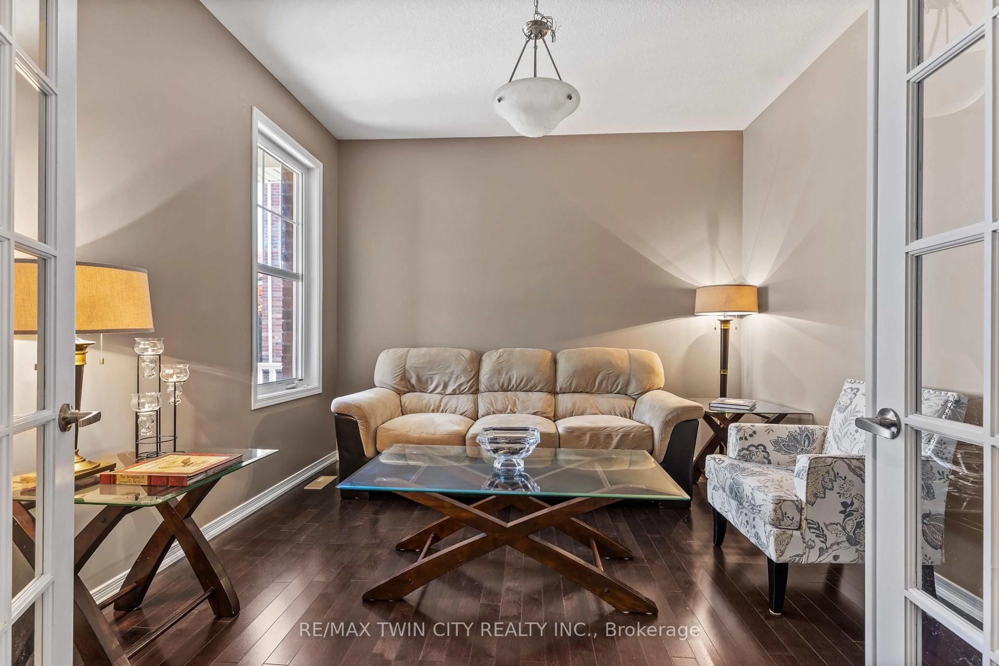 Living room with furniture, wood/laminate floor for 304 Falling Green Cres, Kitchener Ontario N2R 0E9