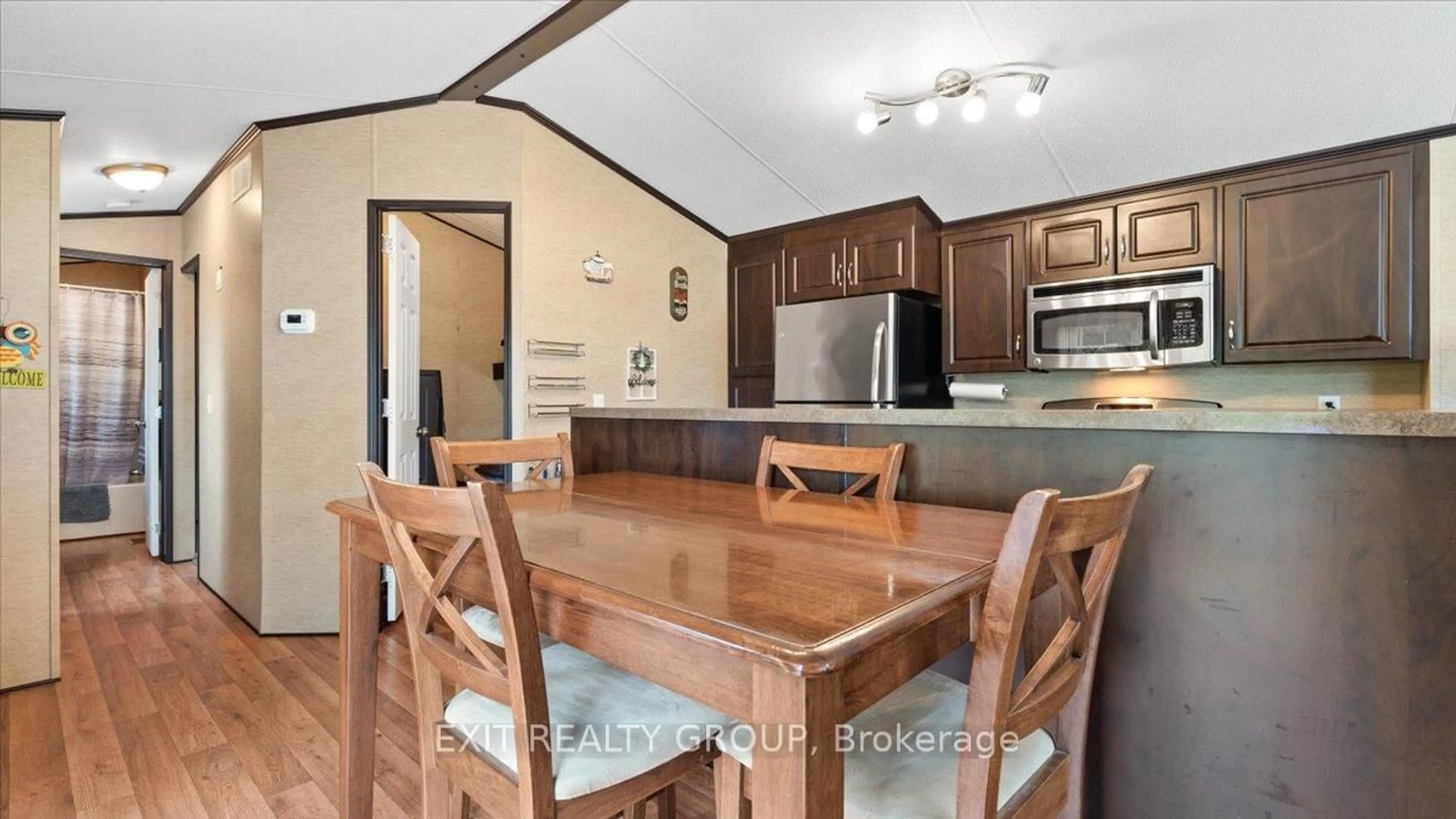 Open concept kitchen, wood/laminate floor for 57 Cooke Lane, Hastings Ontario K0K 2C0