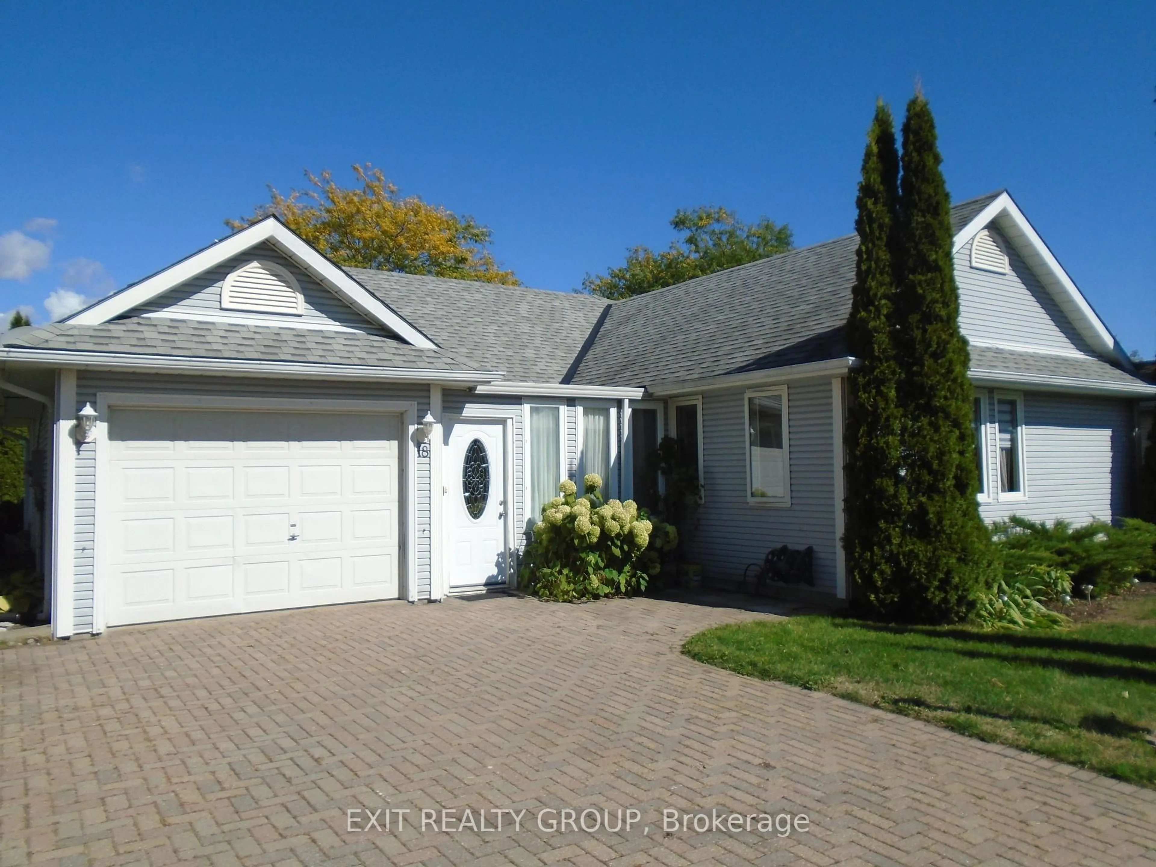 Home with vinyl exterior material, street for 18 Heritage Dr, Prince Edward County Ontario K0K 3L0