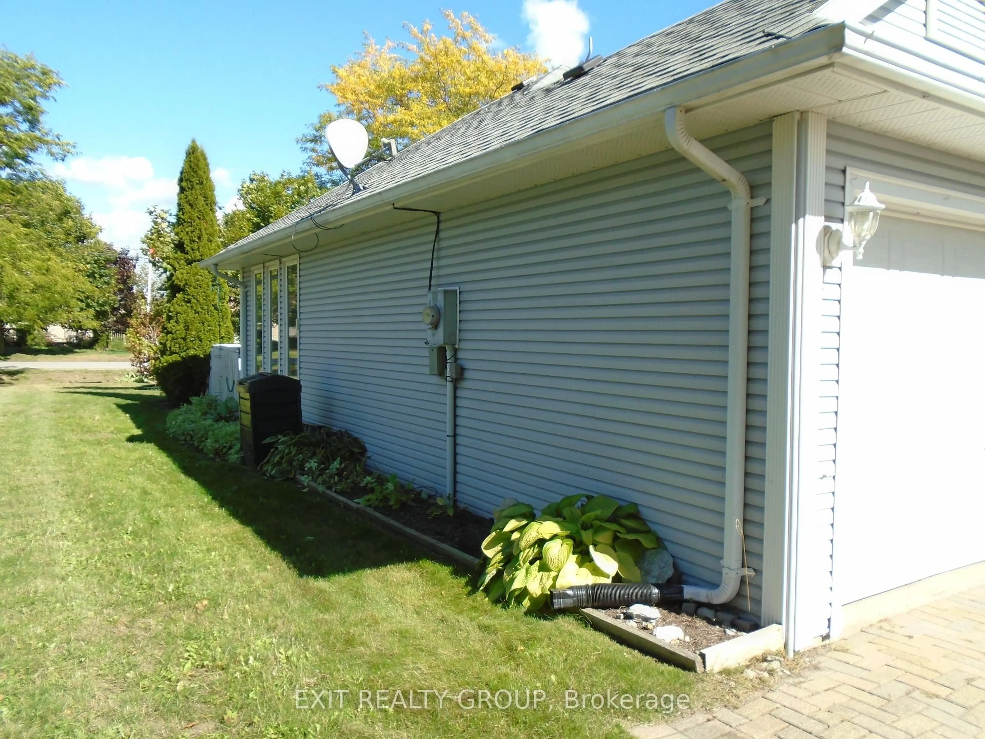 Home with vinyl exterior material, street for 18 Heritage Dr, Prince Edward County Ontario K0K 3L0