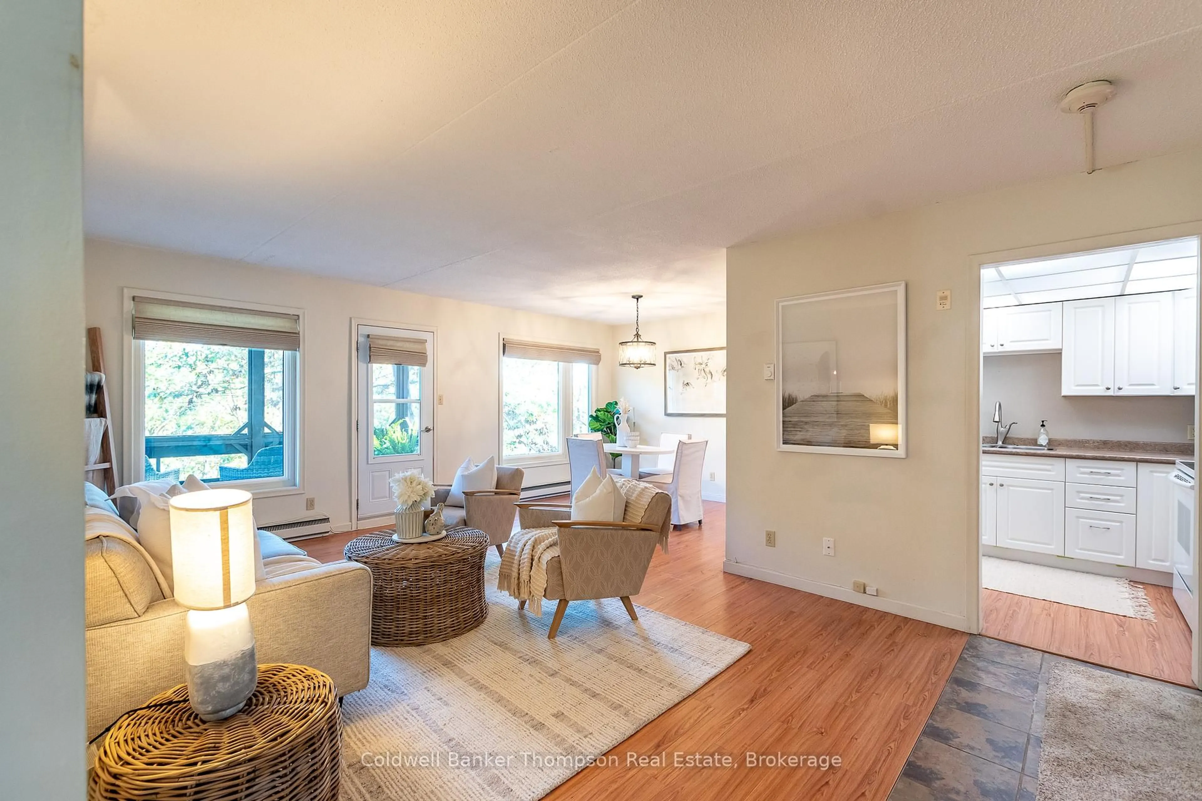 Living room with furniture, wood/laminate floor for 26 Herman Ave #22, Huntsville Ontario P1H 1J6