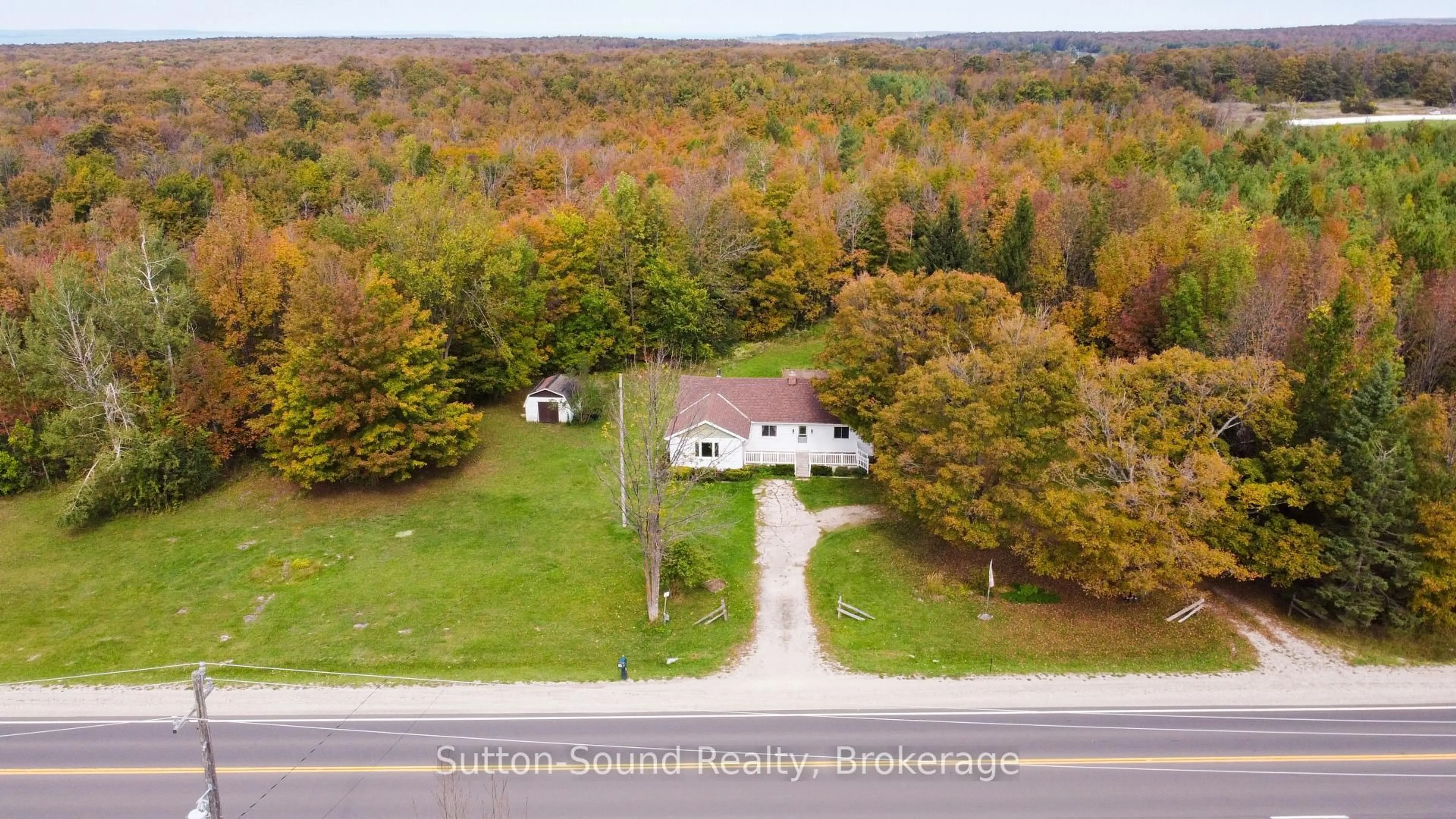 A pic from outside/outdoor area/front of a property/back of a property/a pic from drone, unknown for 204521 Highway 26, Meaford Ontario N4K 5W4