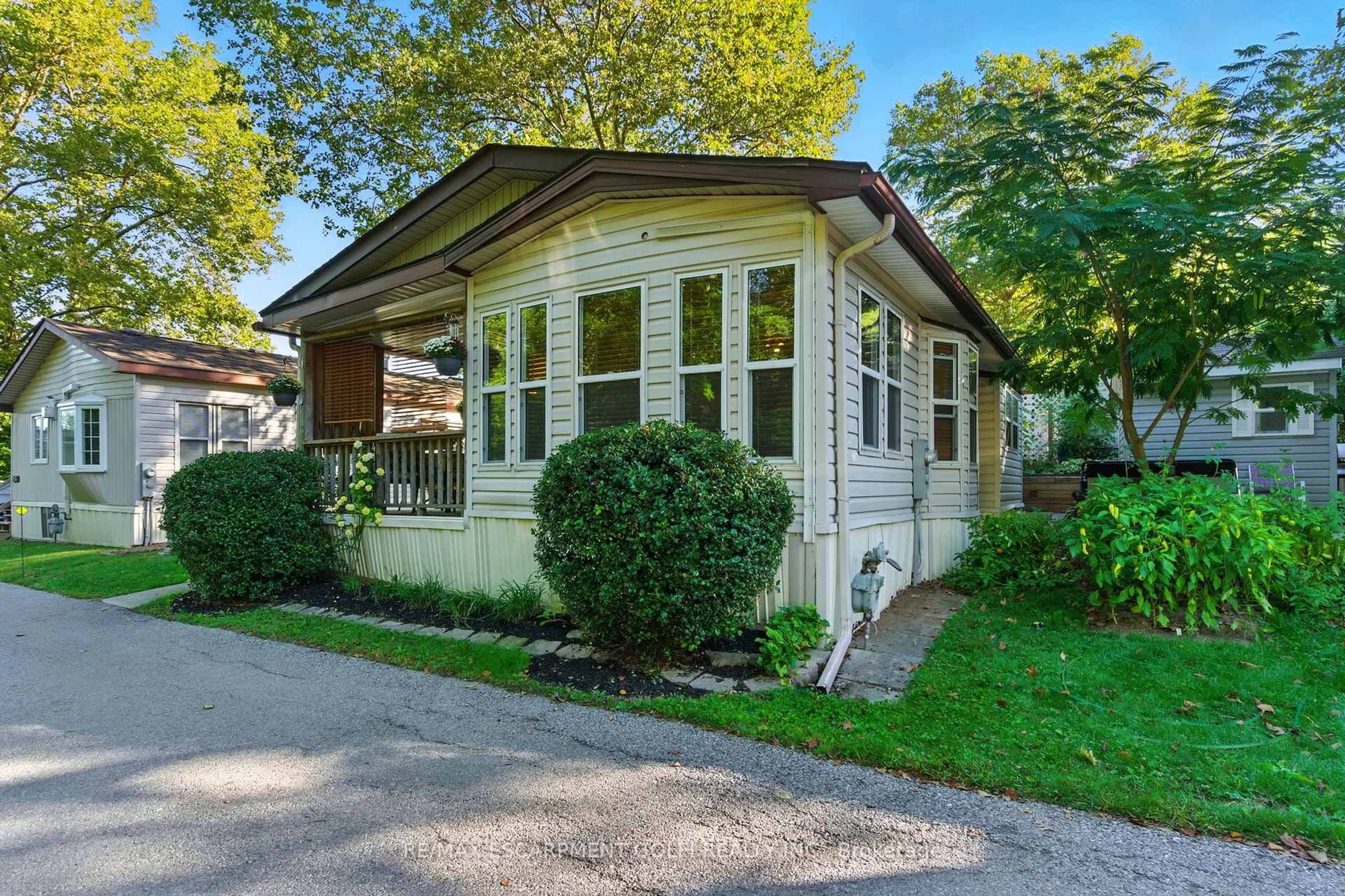 Home with vinyl exterior material, street for 23 Four Mile Creek Rd #411, Niagara-on-the-Lake Ontario L0S 1J1