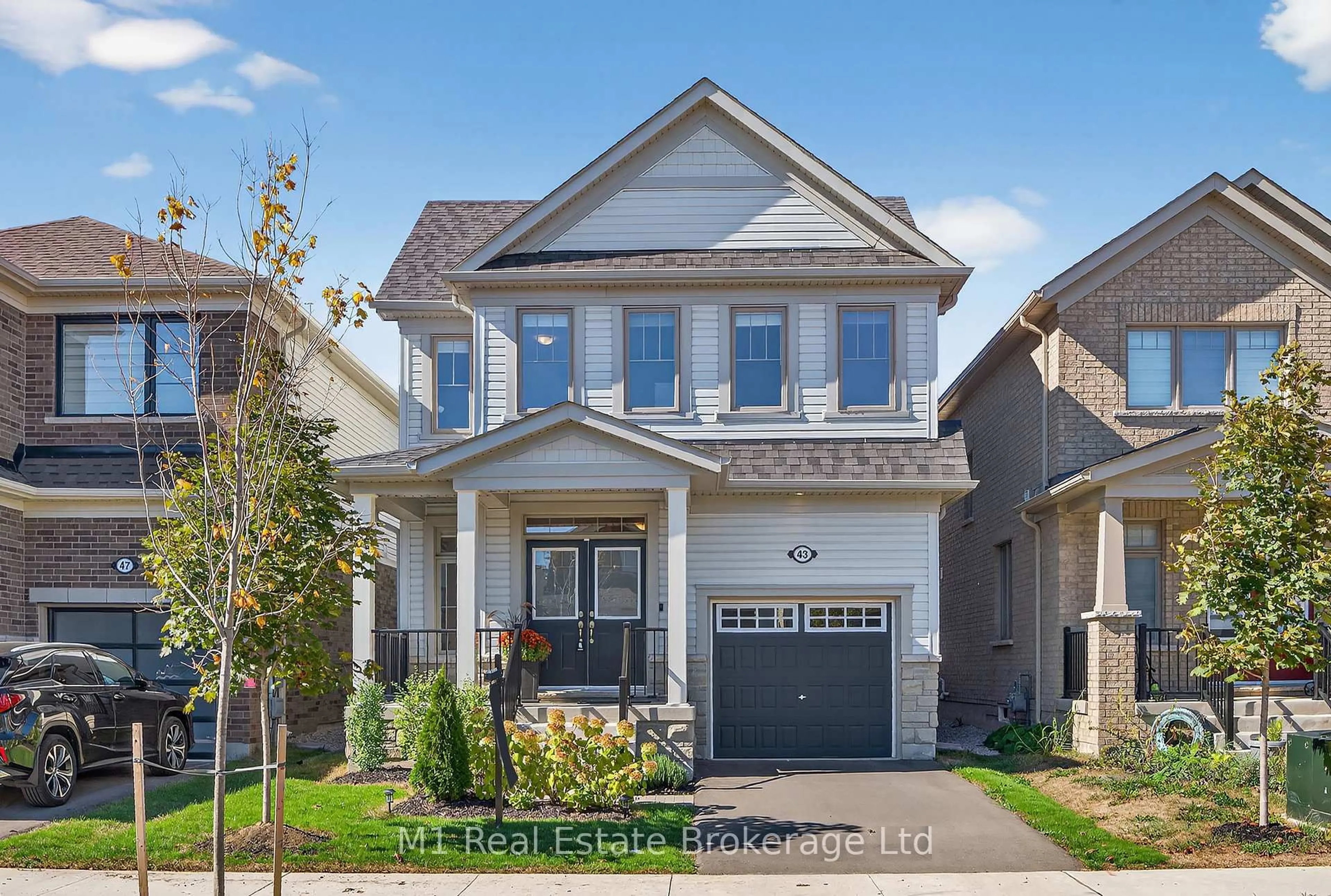 Home with brick exterior material, street for 43 Harpin Way, Centre Wellington Ontario N1M 0H7