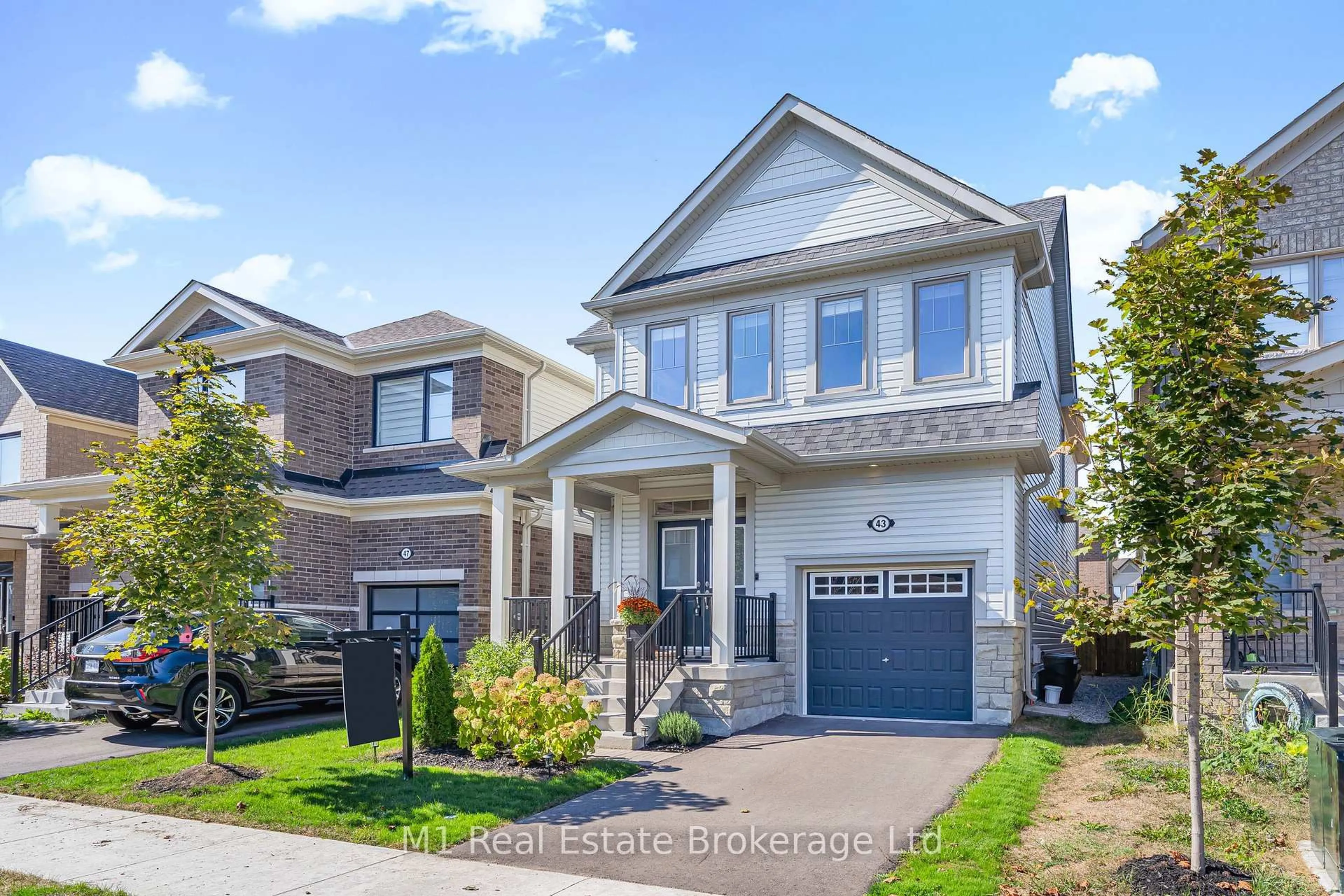 Home with brick exterior material, street for 43 Harpin Way, Centre Wellington Ontario N1M 0H7