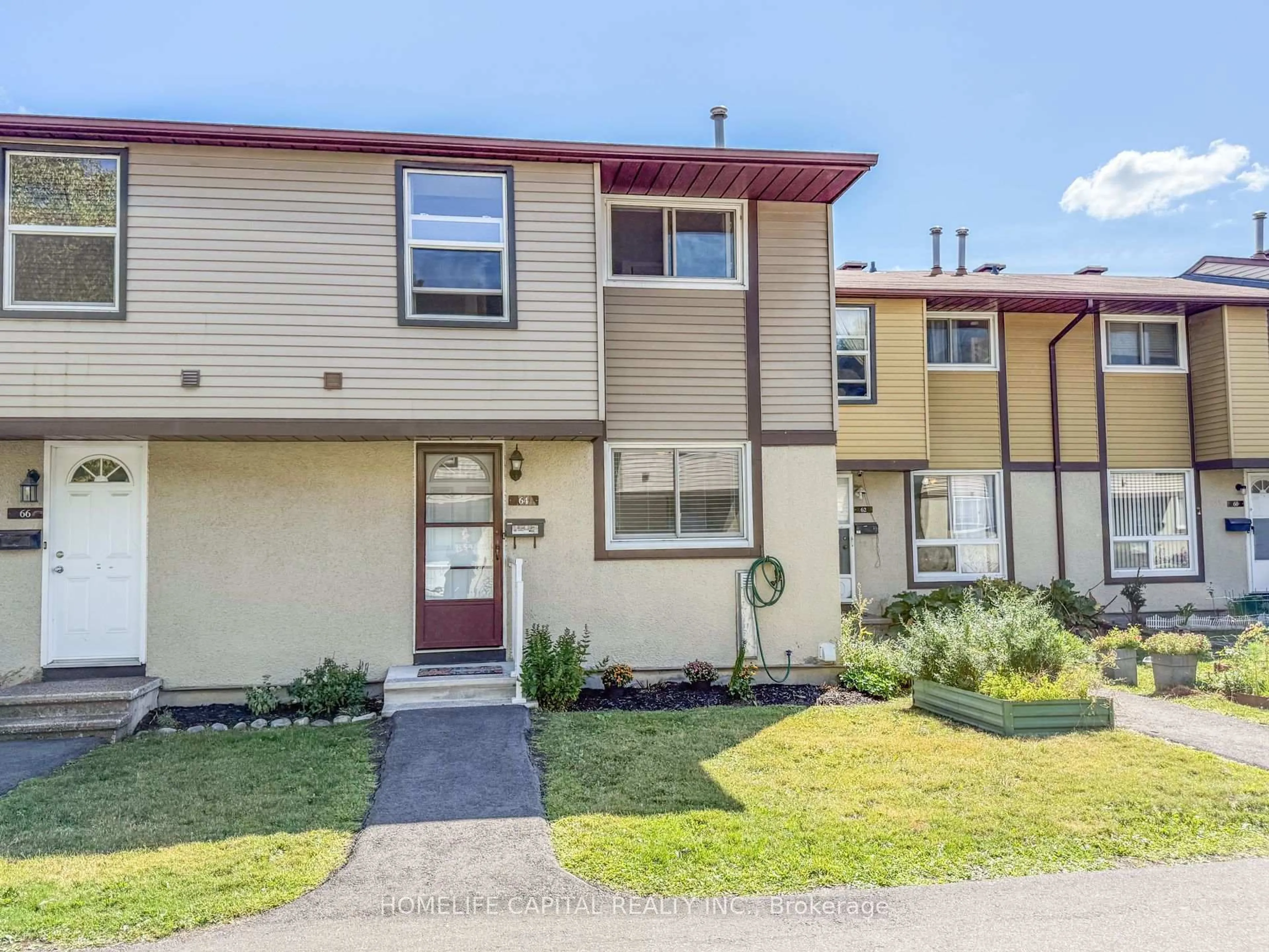 Home with vinyl exterior material, street for 2570 Southvale Cres #64, Ottawa Ontario K1B 5B7