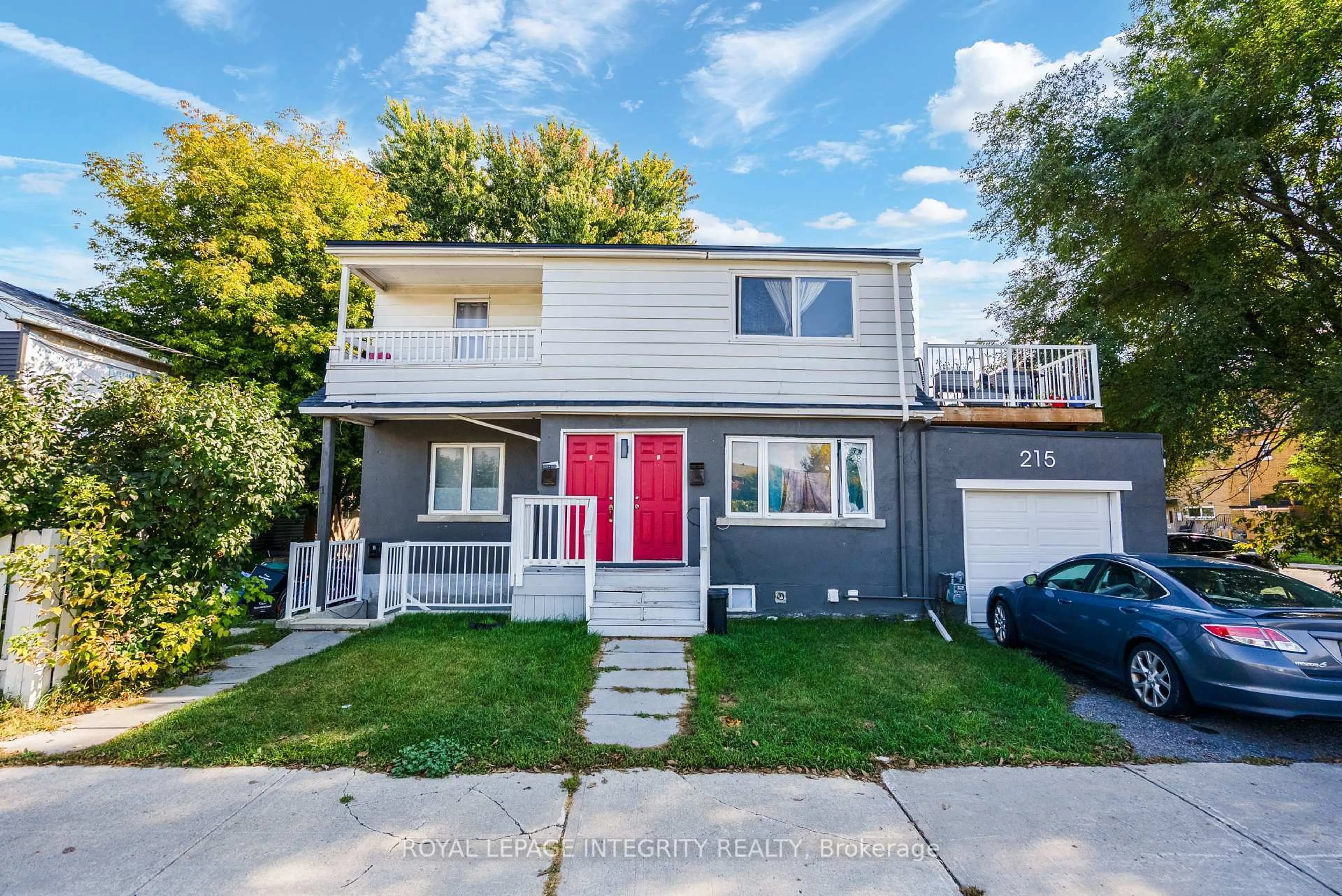 Home with vinyl exterior material, street for 215 Baribeau St, Ottawa Ontario K1L 7R5