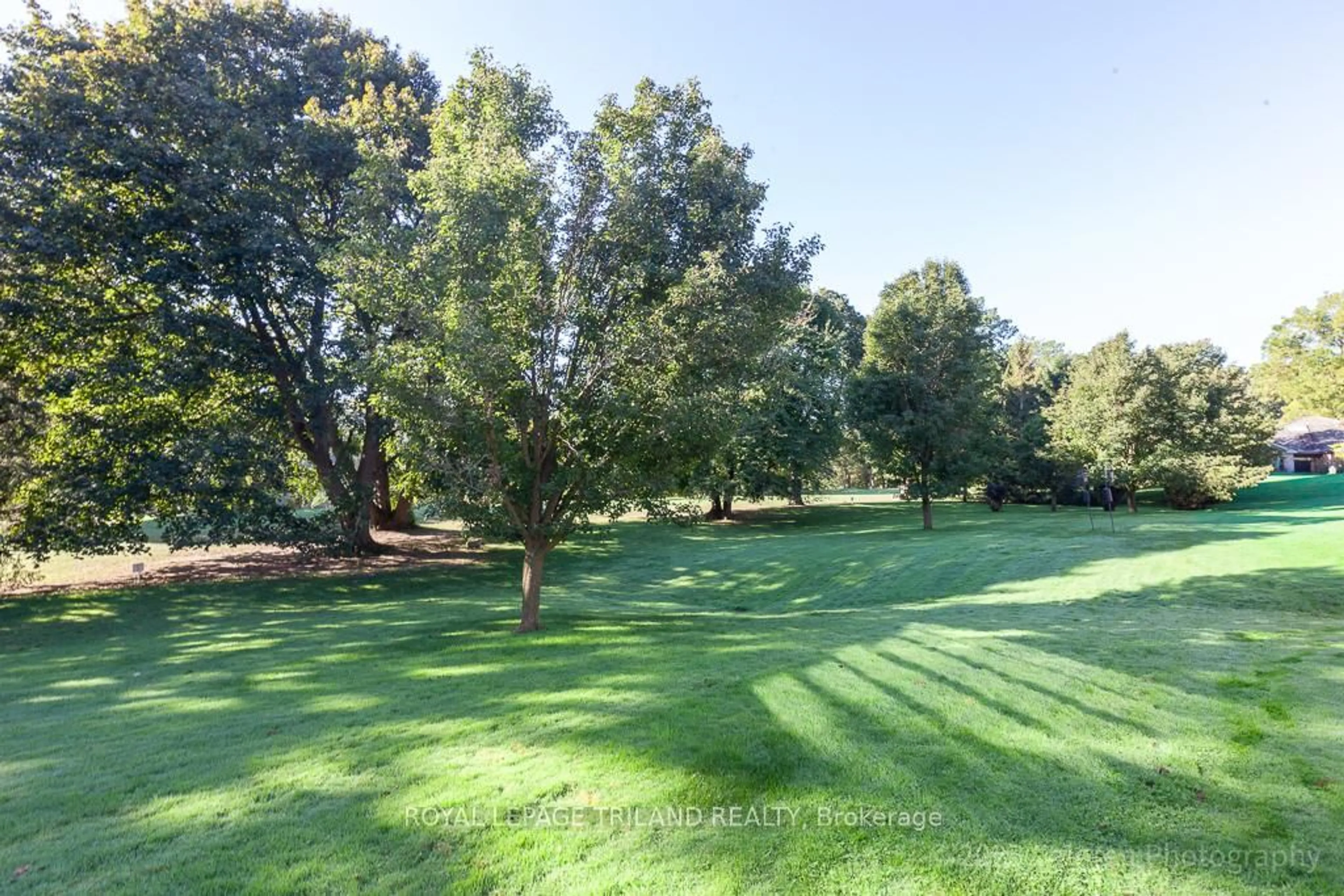 A pic from outside/outdoor area/front of a property/back of a property/a pic from drone, forest/trees view for 1040 Riverside Dr #23, London North Ontario N6H 5N4