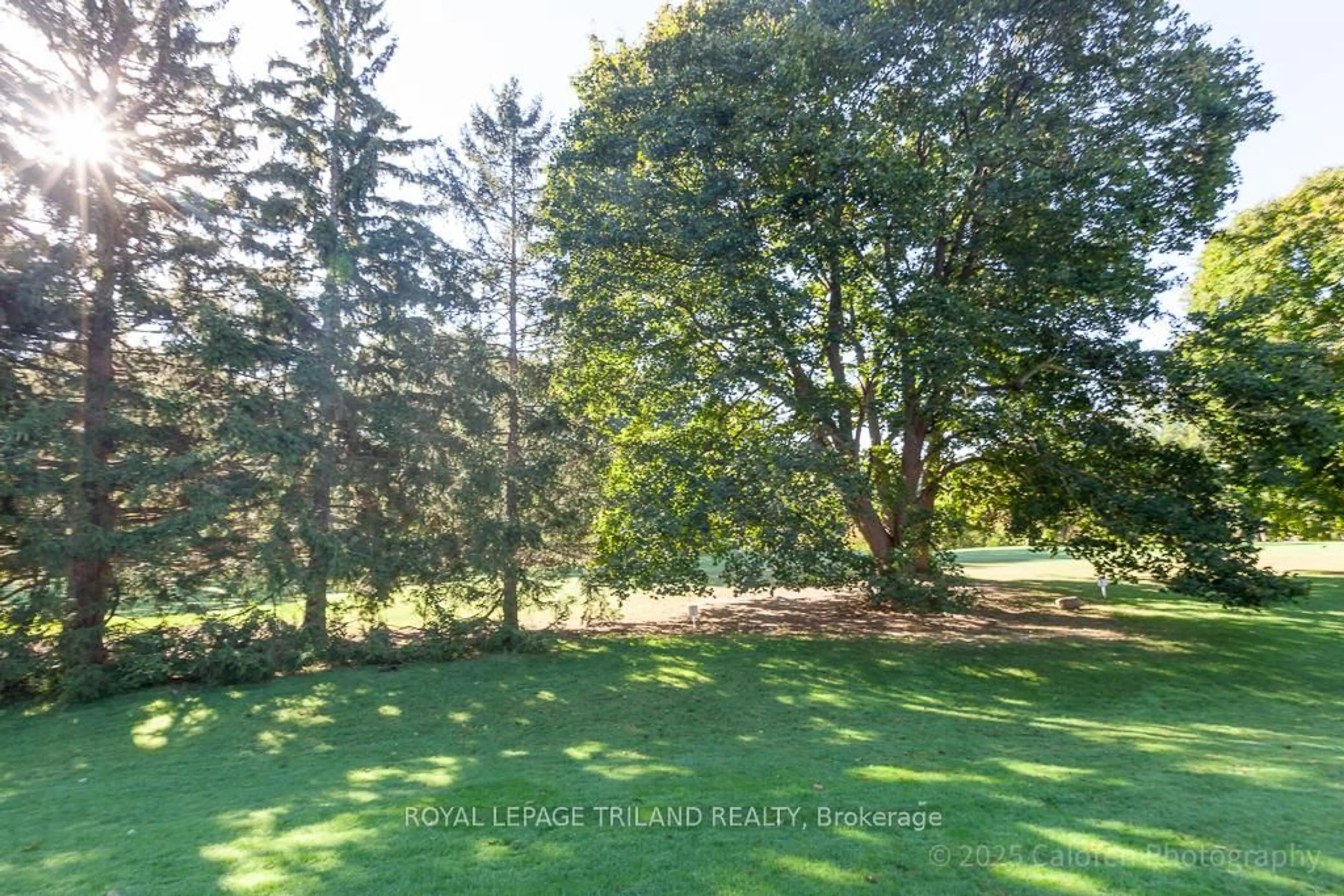 A pic from outside/outdoor area/front of a property/back of a property/a pic from drone, forest/trees view for 1040 Riverside Dr #23, London North Ontario N6H 5N4