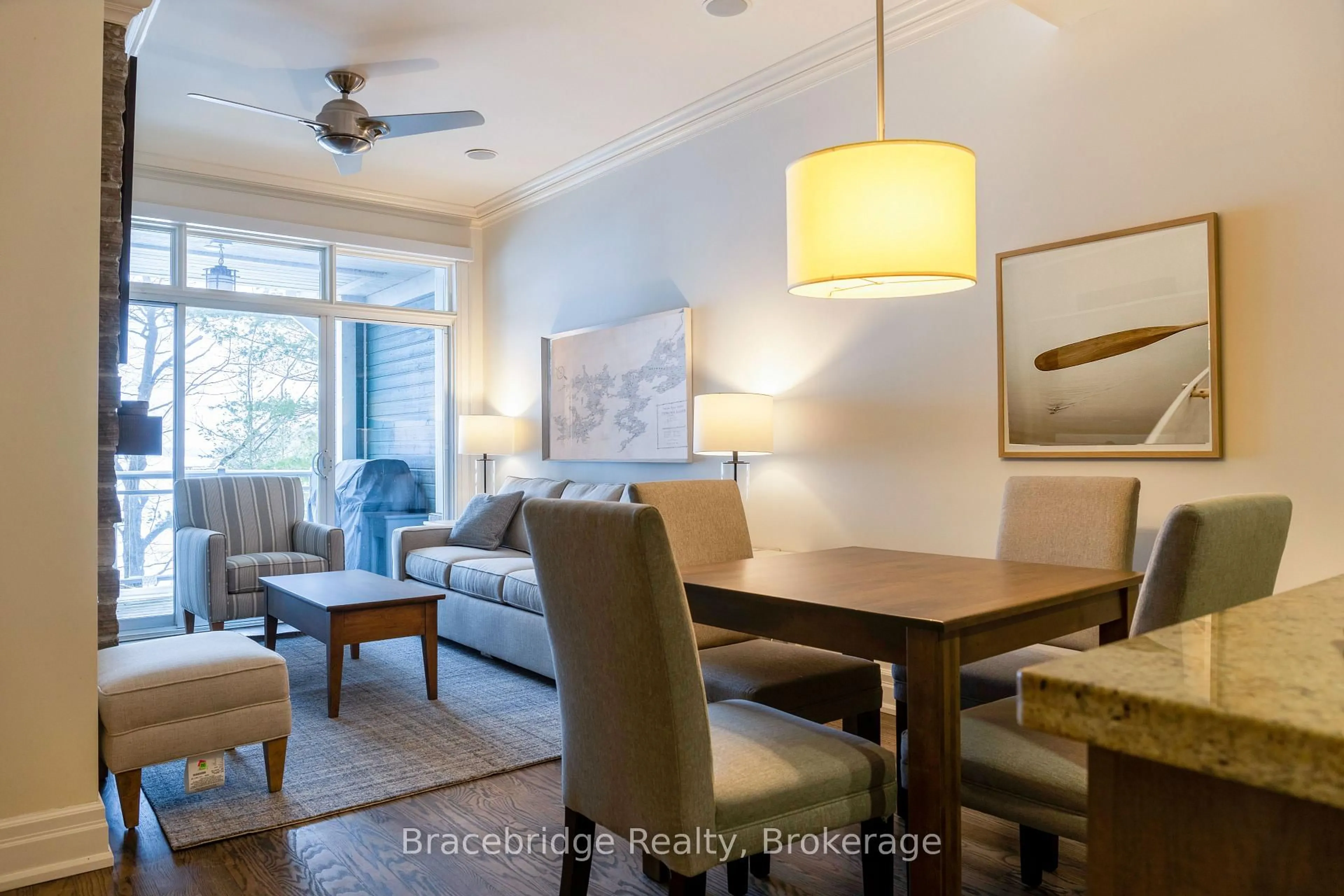 Living room with furniture, wood/laminate floor for 1869 Muskoka 118 Rd #A102-C2, Muskoka Lakes Ontario P1L 1W8