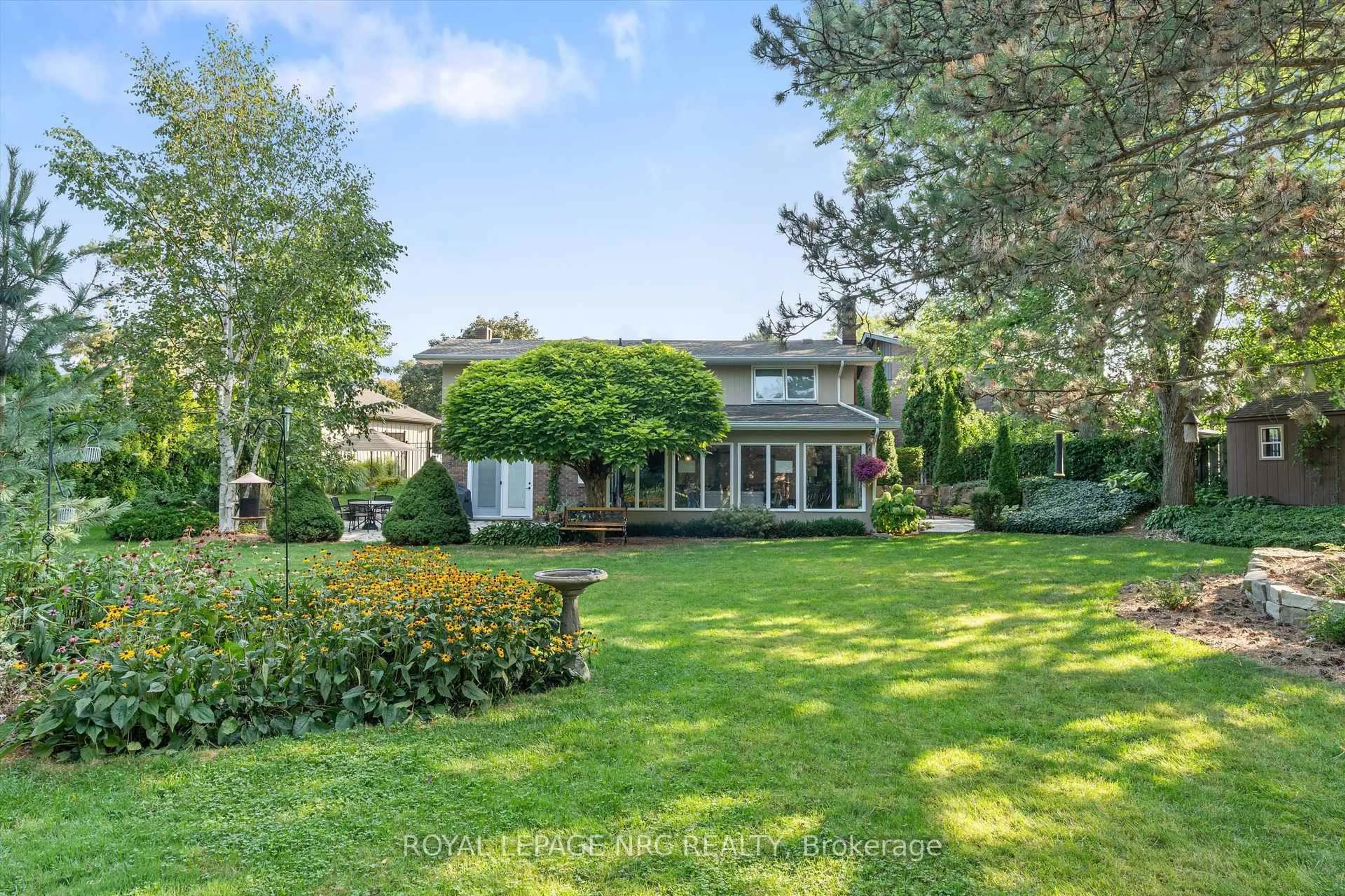 A pic from outside/outdoor area/front of a property/back of a property/a pic from drone, water/lake/river/ocean view for 42 The Cedars, St. Catharines Ontario L2M 6M8