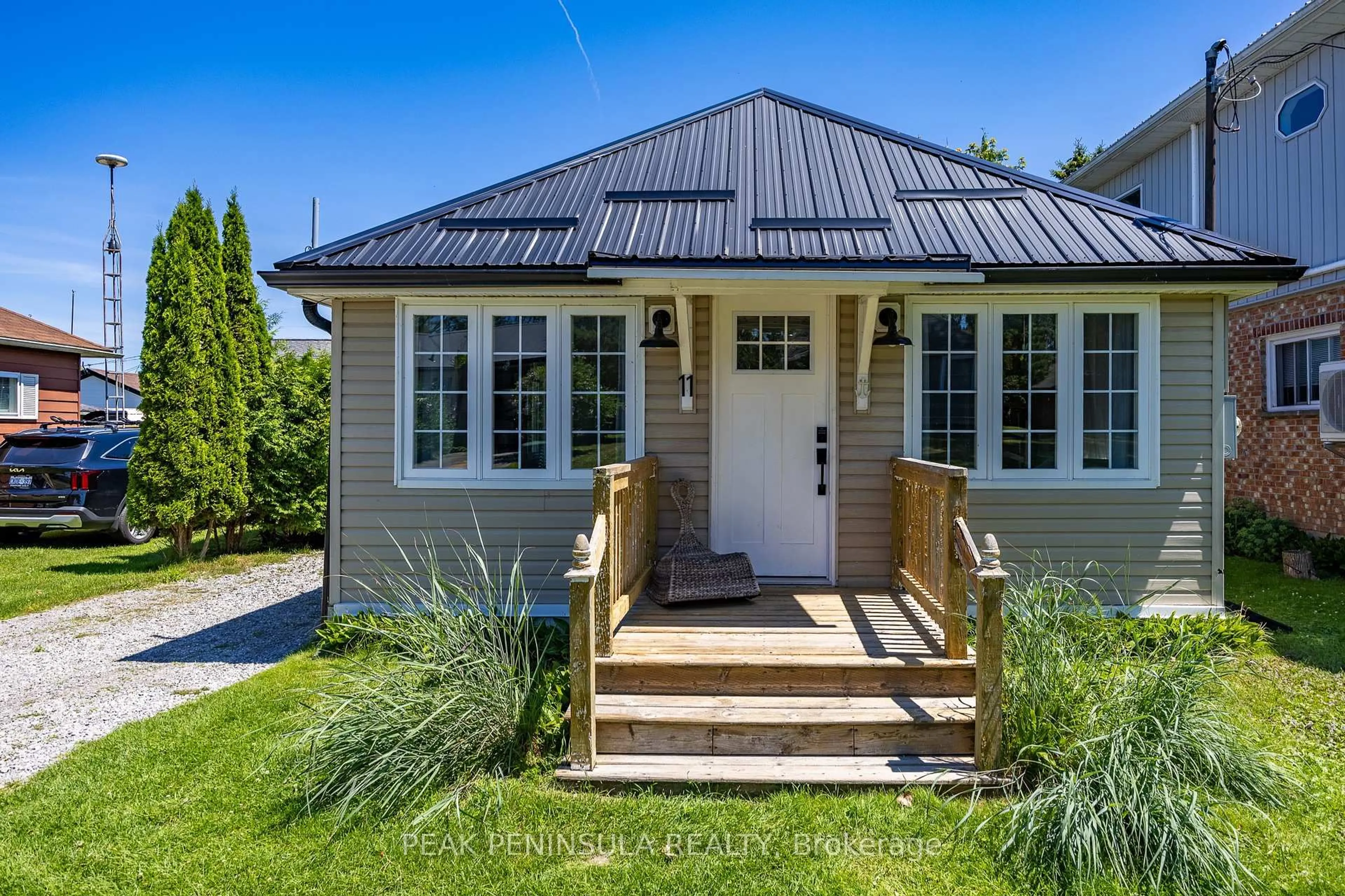 Home with vinyl exterior material, street for 11 Bass Lane, Norfolk Ontario N0E 1M0