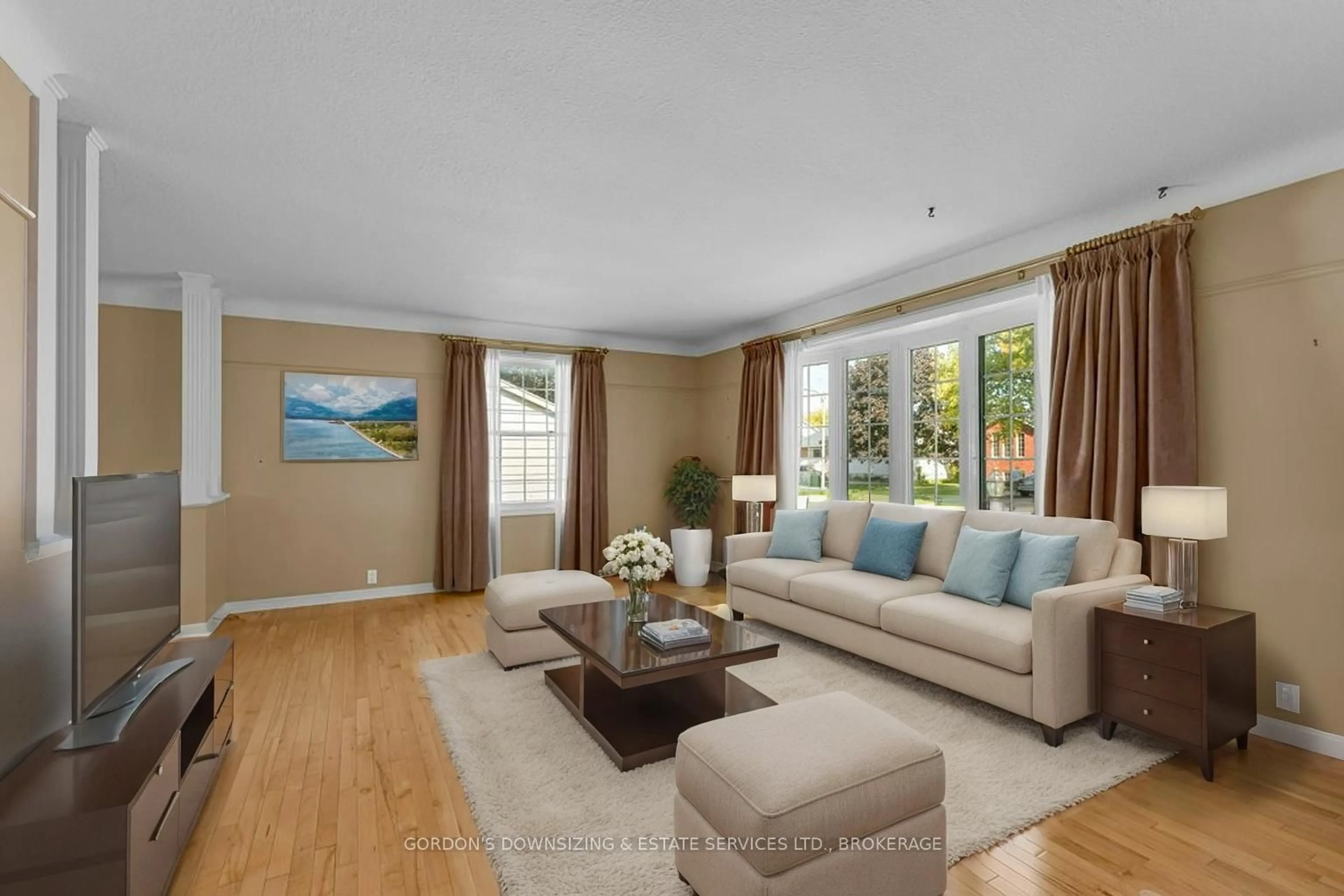 Living room with furniture, wood/laminate floor for 170 Elmwood Dr, Gananoque Ontario K7G 1N9