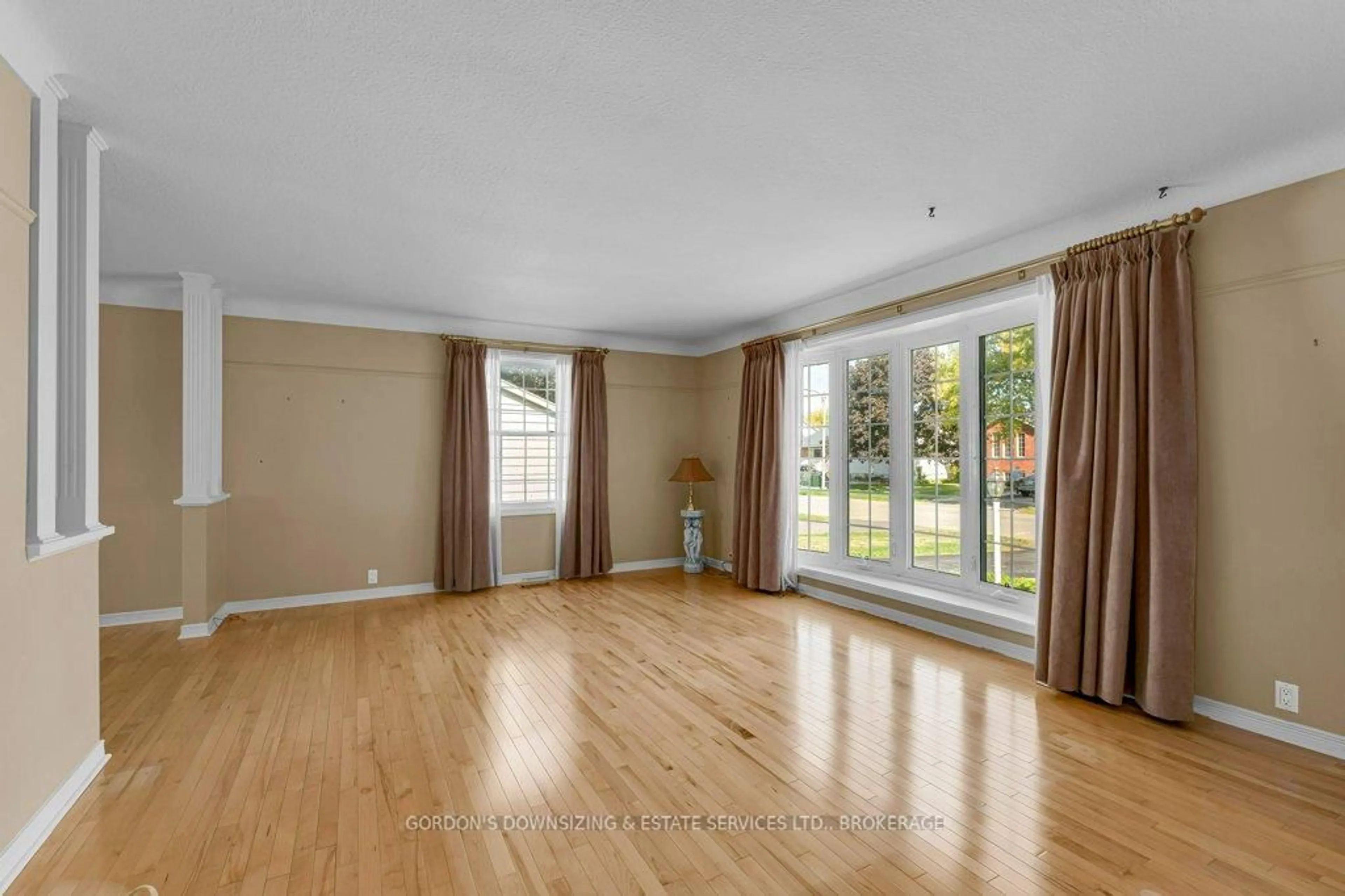 Living room with furniture, wood/laminate floor for 170 Elmwood Dr, Gananoque Ontario K7G 1N9