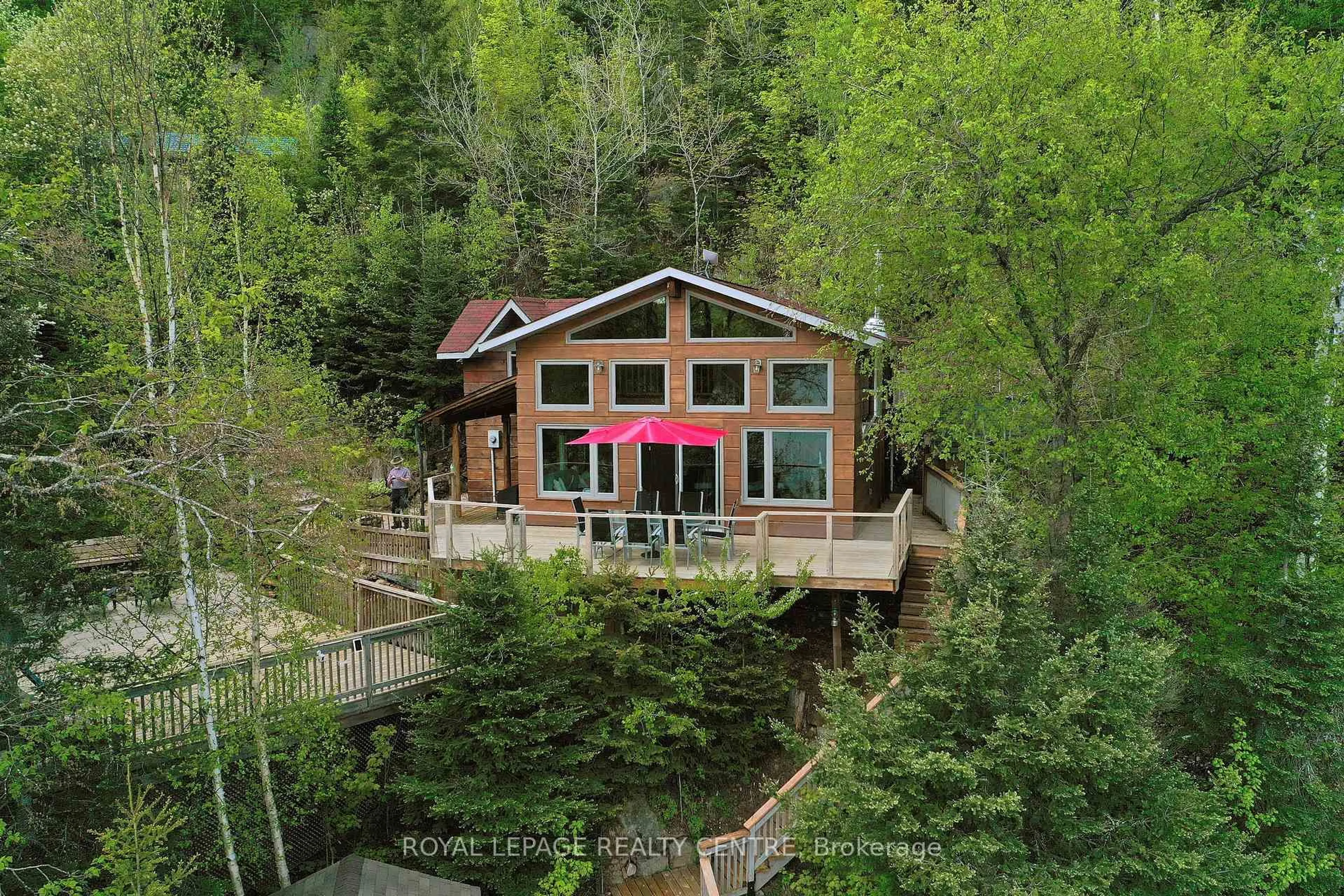 A pic from outside/outdoor area/front of a property/back of a property/a pic from drone, water/lake/river/ocean view for 63 Rouff Rd, Powassan Ontario P0H 2L0