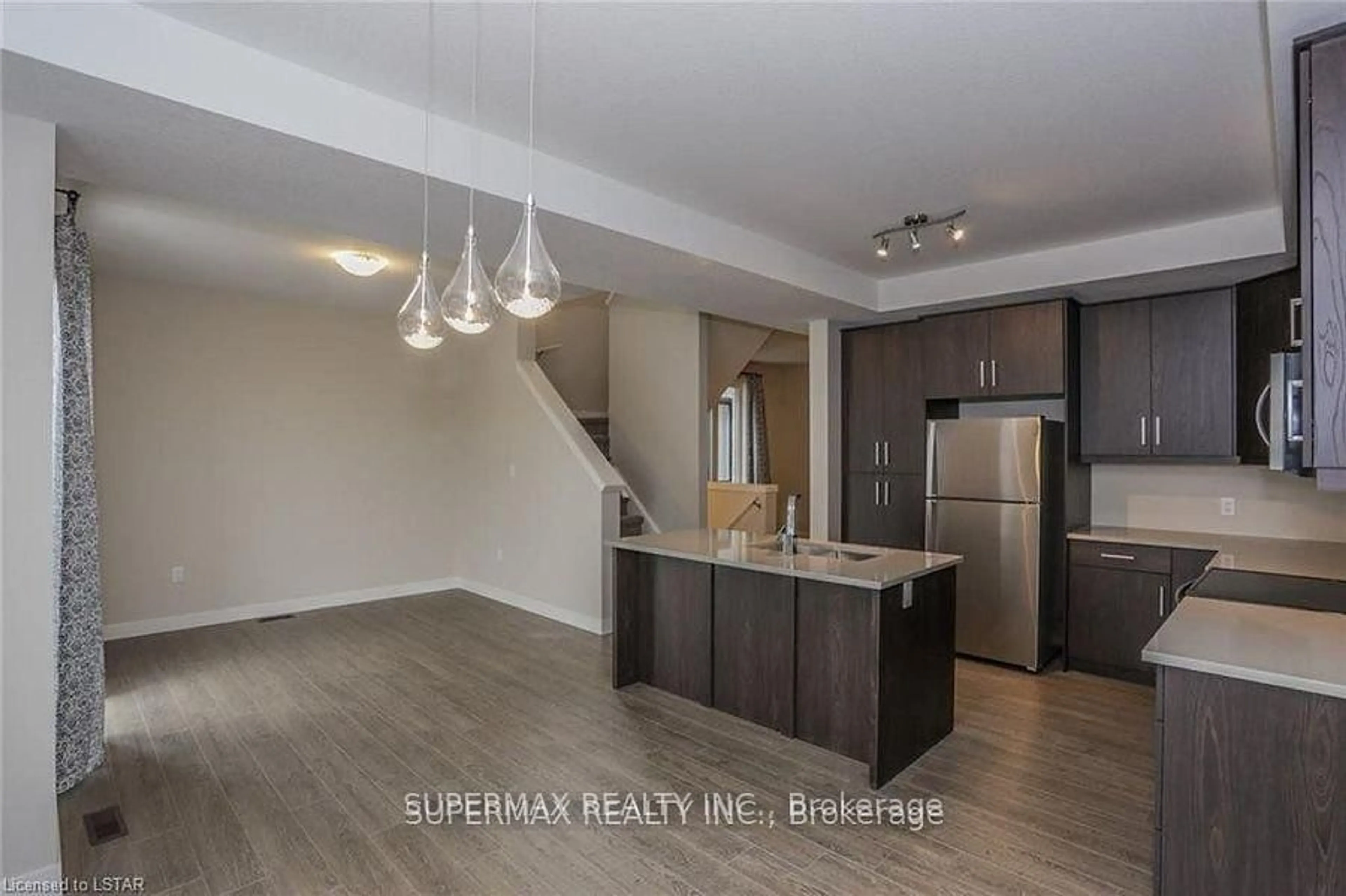 Open concept kitchen, wood/laminate floor for 951 Georgetown Dr, London North Ontario N6H 0J7