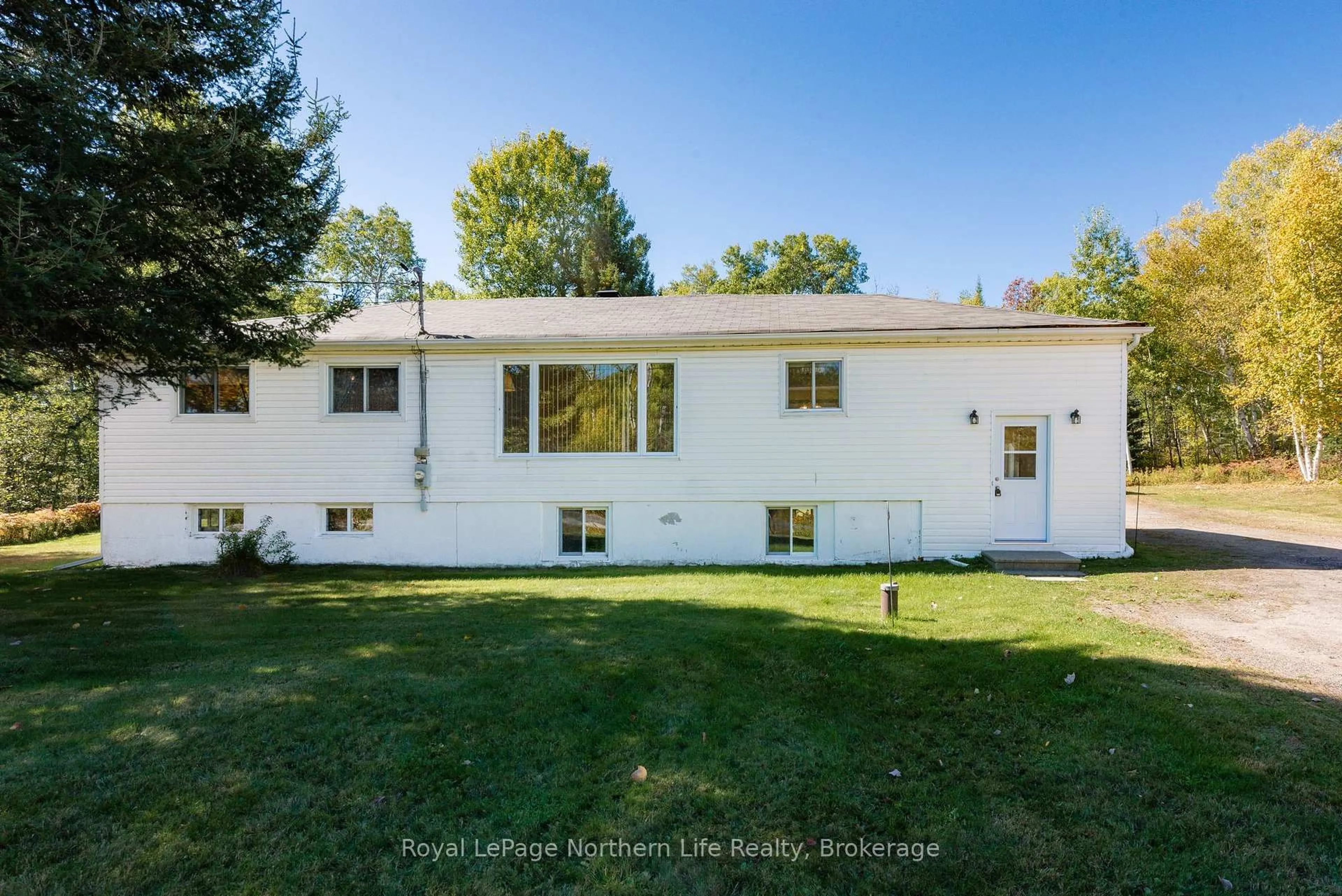 Home with vinyl exterior material, street for 92 Highway 94, East Ferris Ontario P0H 1K0