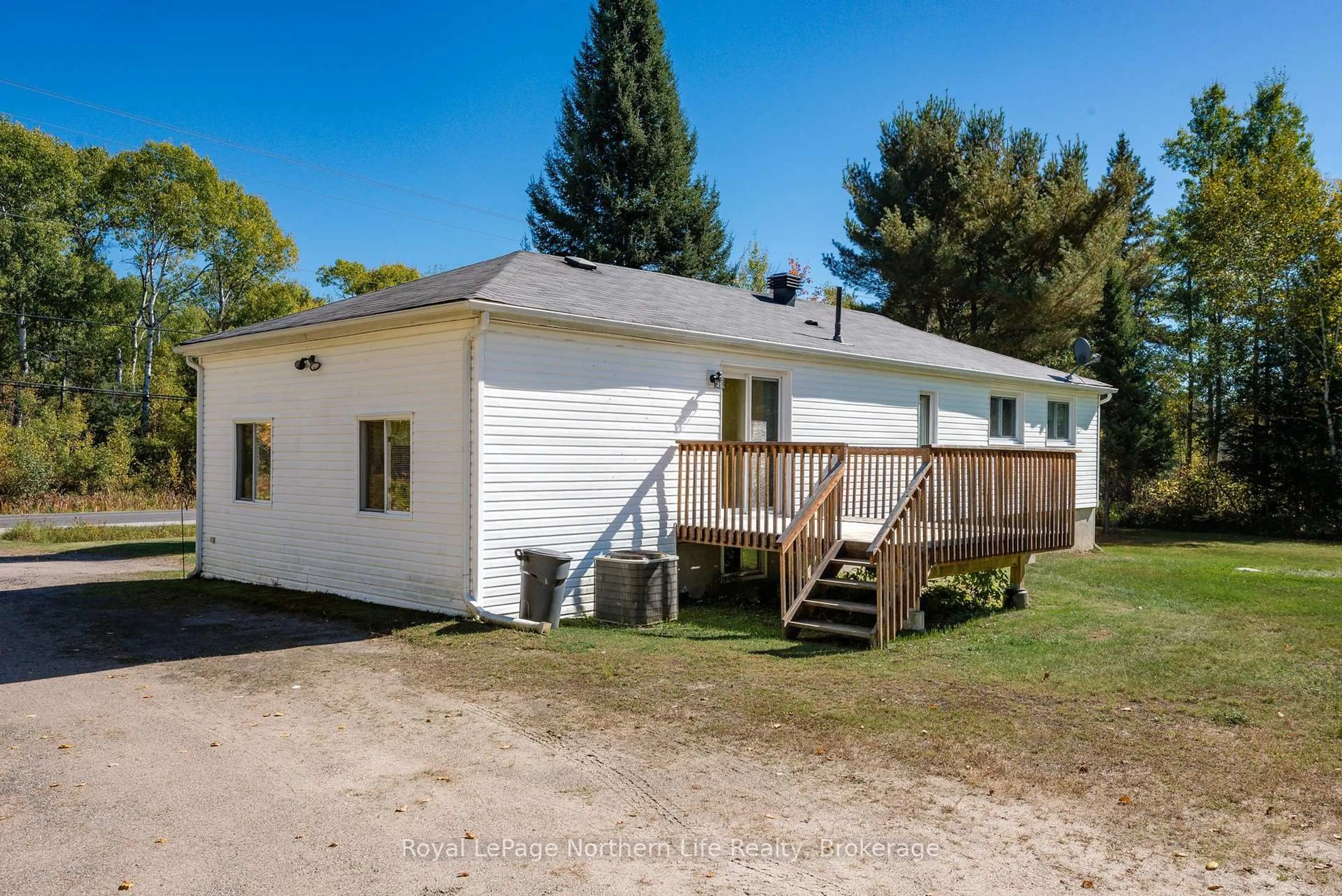A pic from outside/outdoor area/front of a property/back of a property/a pic from drone, unknown for 92 Highway 94, East Ferris Ontario P0H 1K0