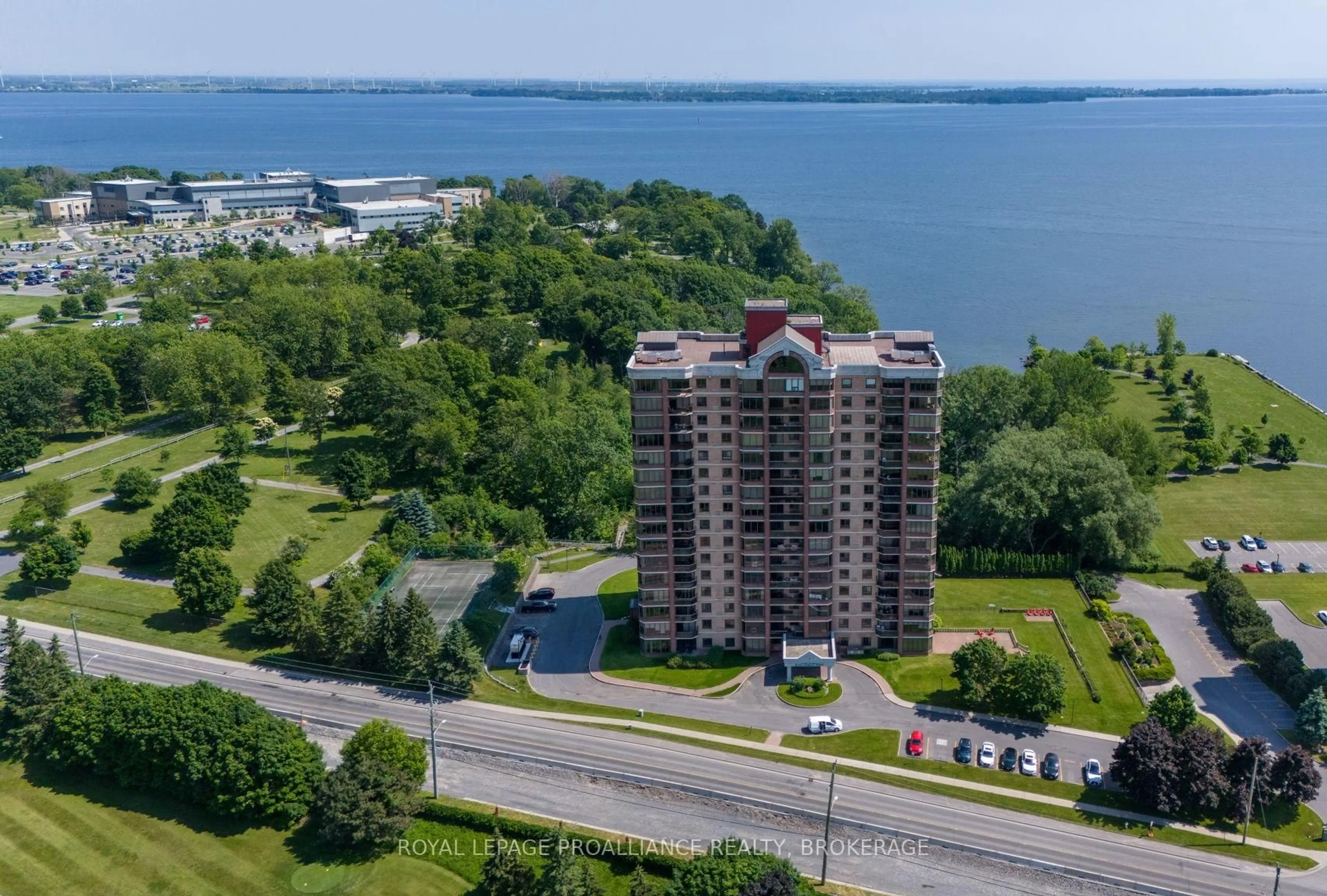 A pic from outside/outdoor area/front of a property/back of a property/a pic from drone, water/lake/river/ocean view for 1000 King St #705, Kingston Ontario K7M 8H3