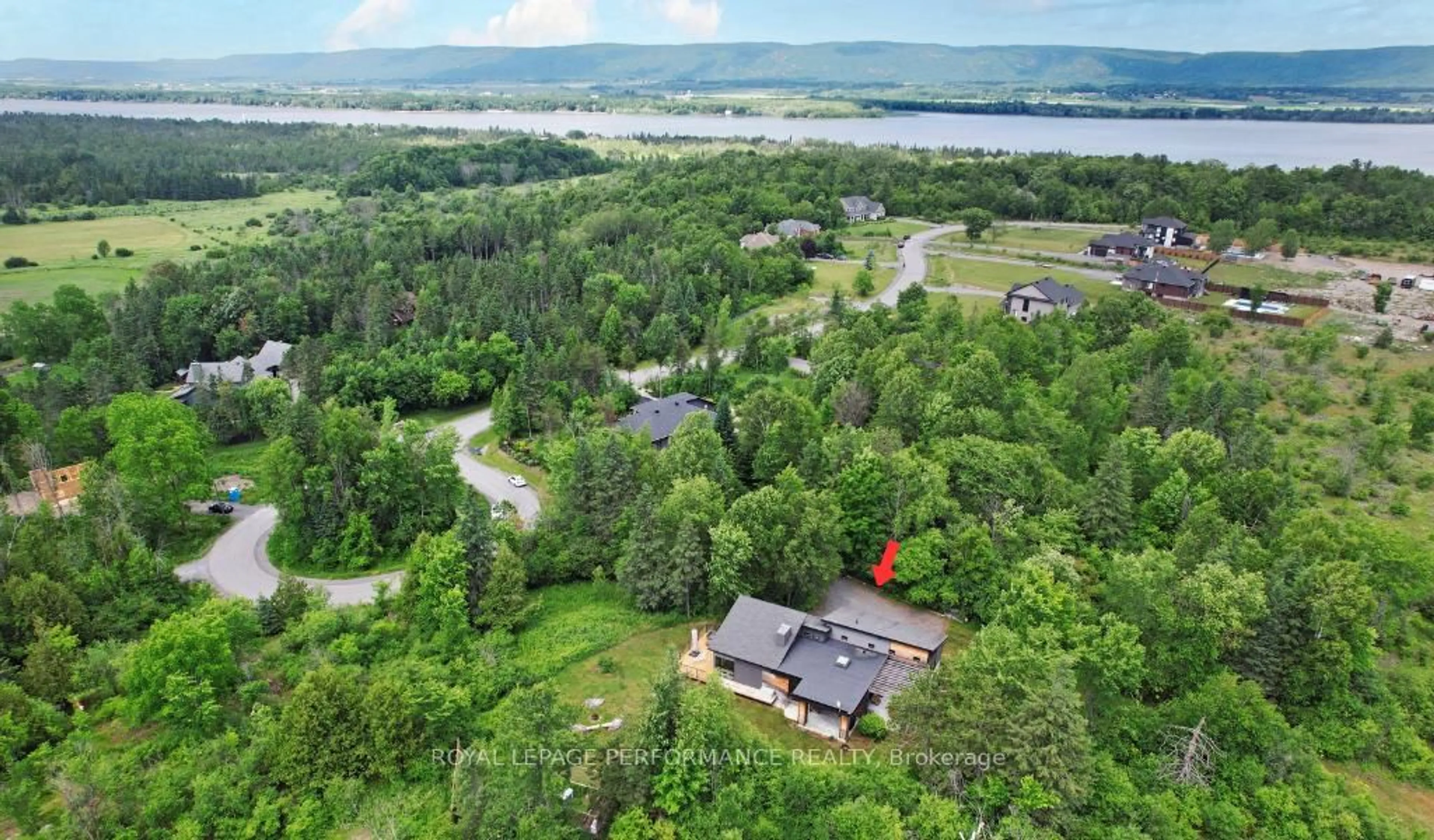 A pic from outside/outdoor area/front of a property/back of a property/a pic from drone, water/lake/river/ocean view for 1141 Julia Crt, Ottawa Ontario K0A 1T0