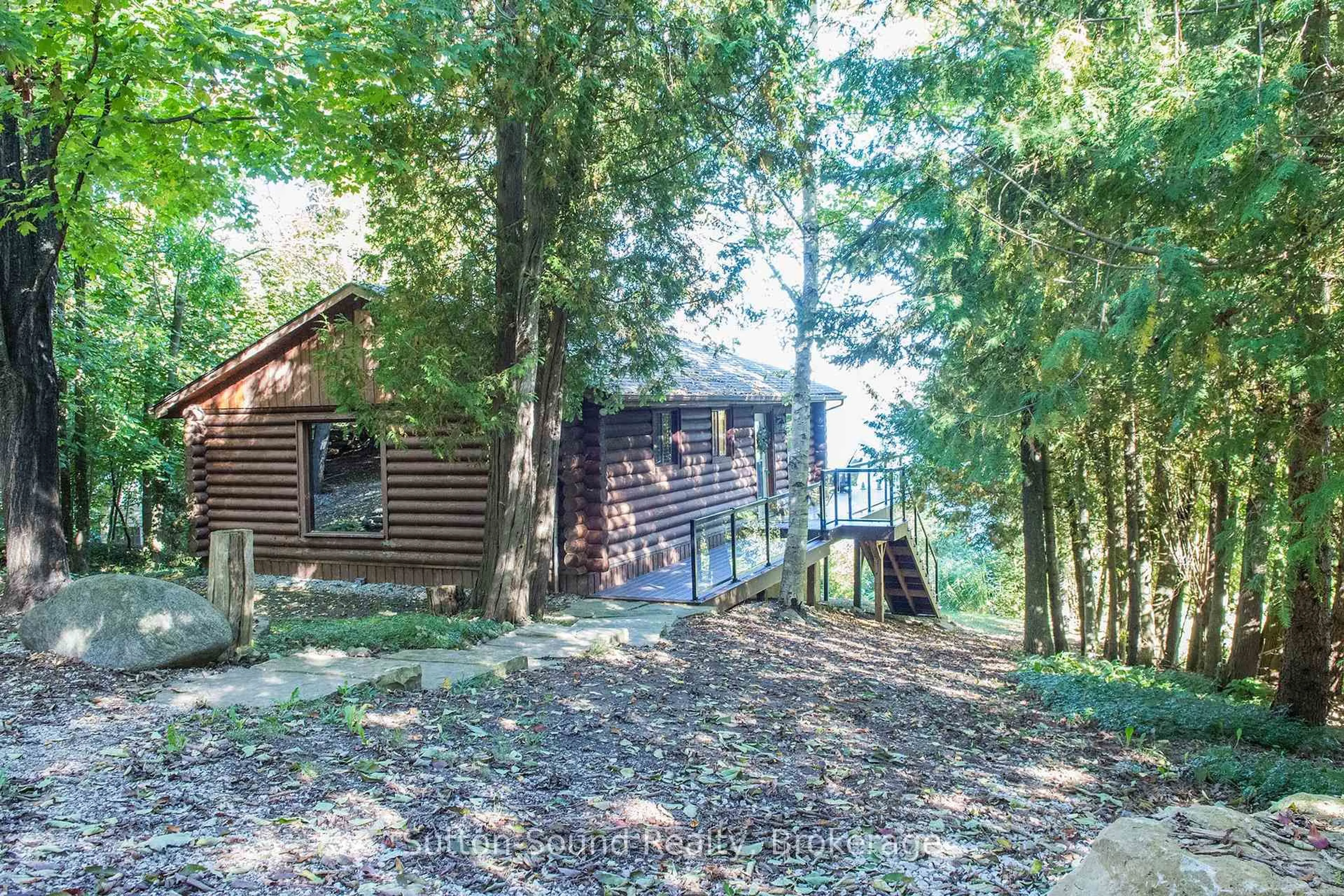 A pic from outside/outdoor area/front of a property/back of a property/a pic from drone, forest/trees view for 103 Ivy Dr, Georgian Bluffs Ontario N0H 2T0